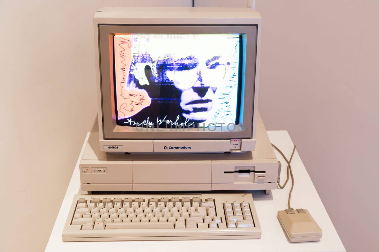Venaria Reale, Italy - October 2022: Computer Commodore Amiga 1000 with floppy disk, mouse, beige