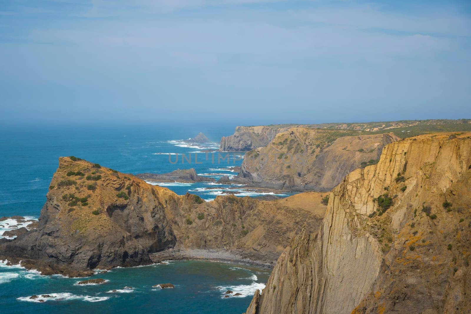 View on the dramatic western coastline, Vicentine Coast, of the Algarve in Portugal, location: Arrifana
