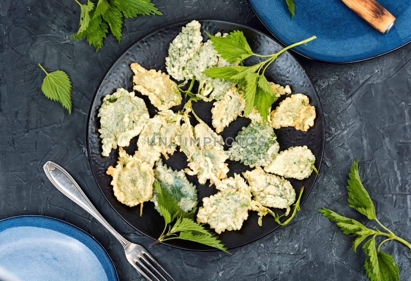 Breaded nettle or battered nettle. Hot spring greens appetizer