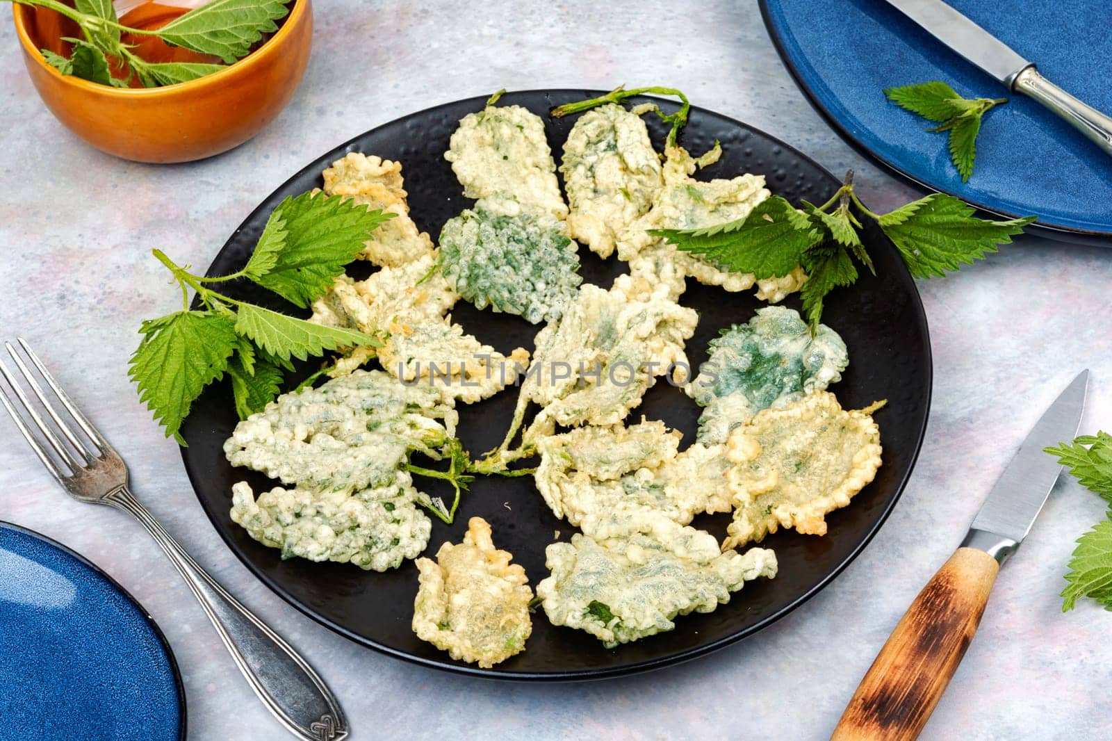 Breaded nettle or battered nettle. Hot spring greens appetizer
