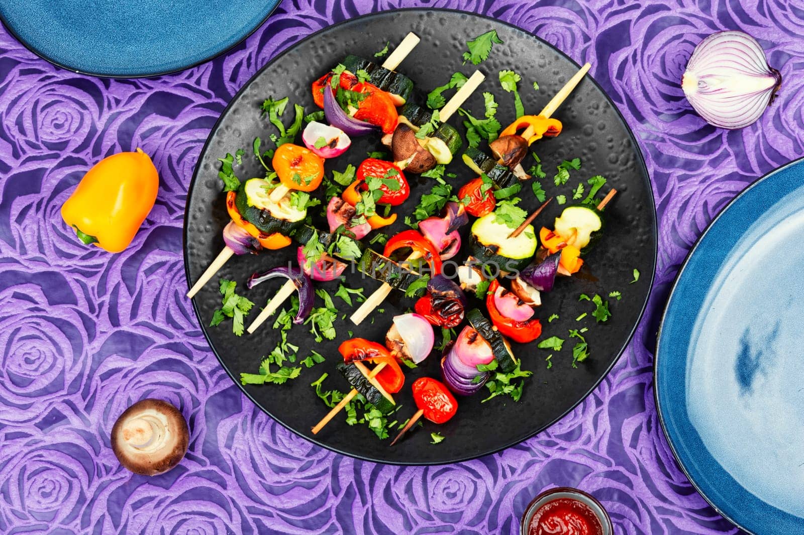 Vegan shashlik of fresh vegetables on wooden skewers. Copy space. Space for text.