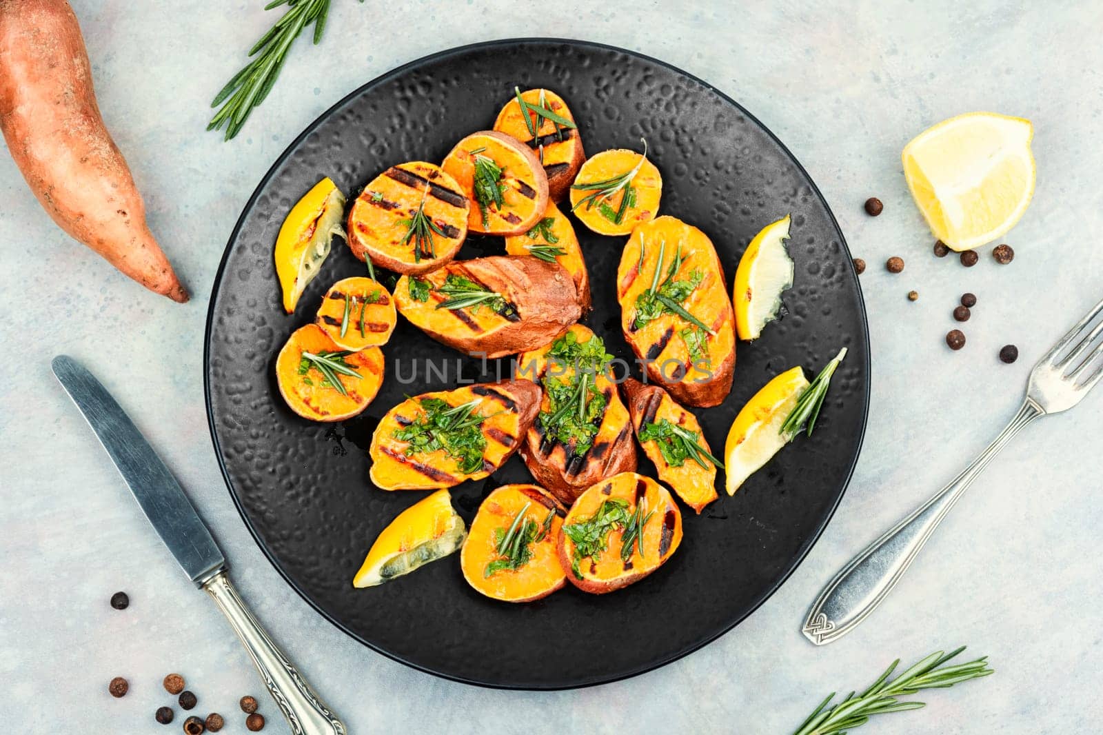 Grilled sweet potato, batata with olive oil and green.