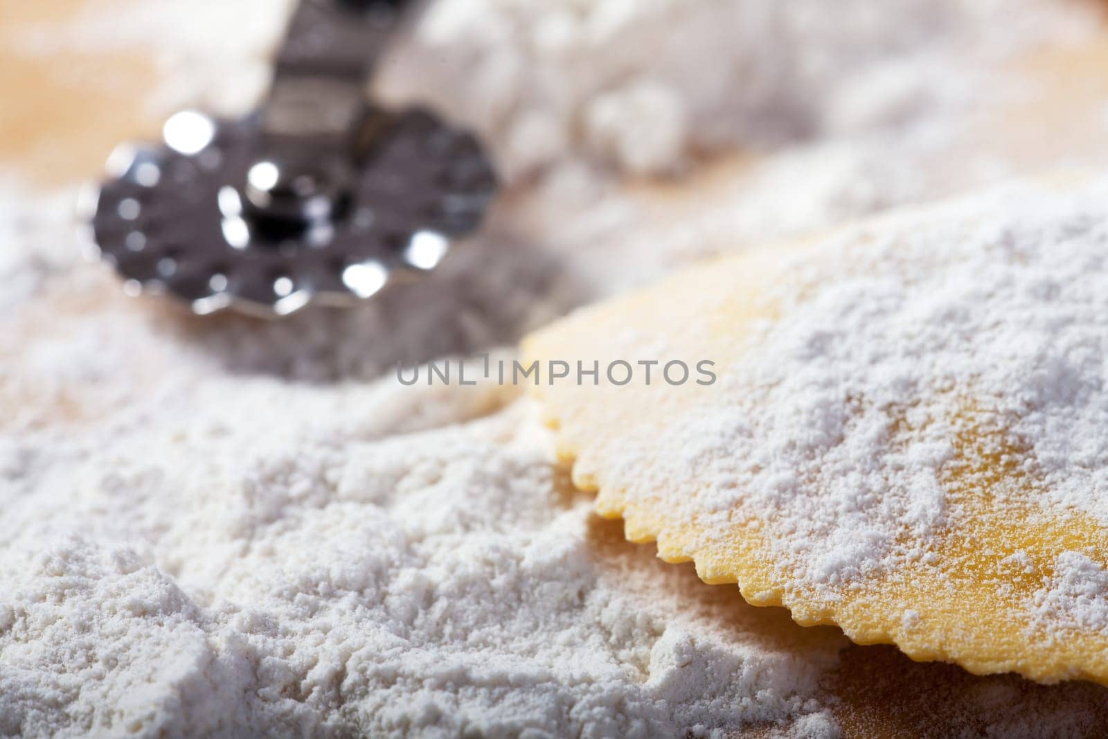 closeup of home made ravioli on wood