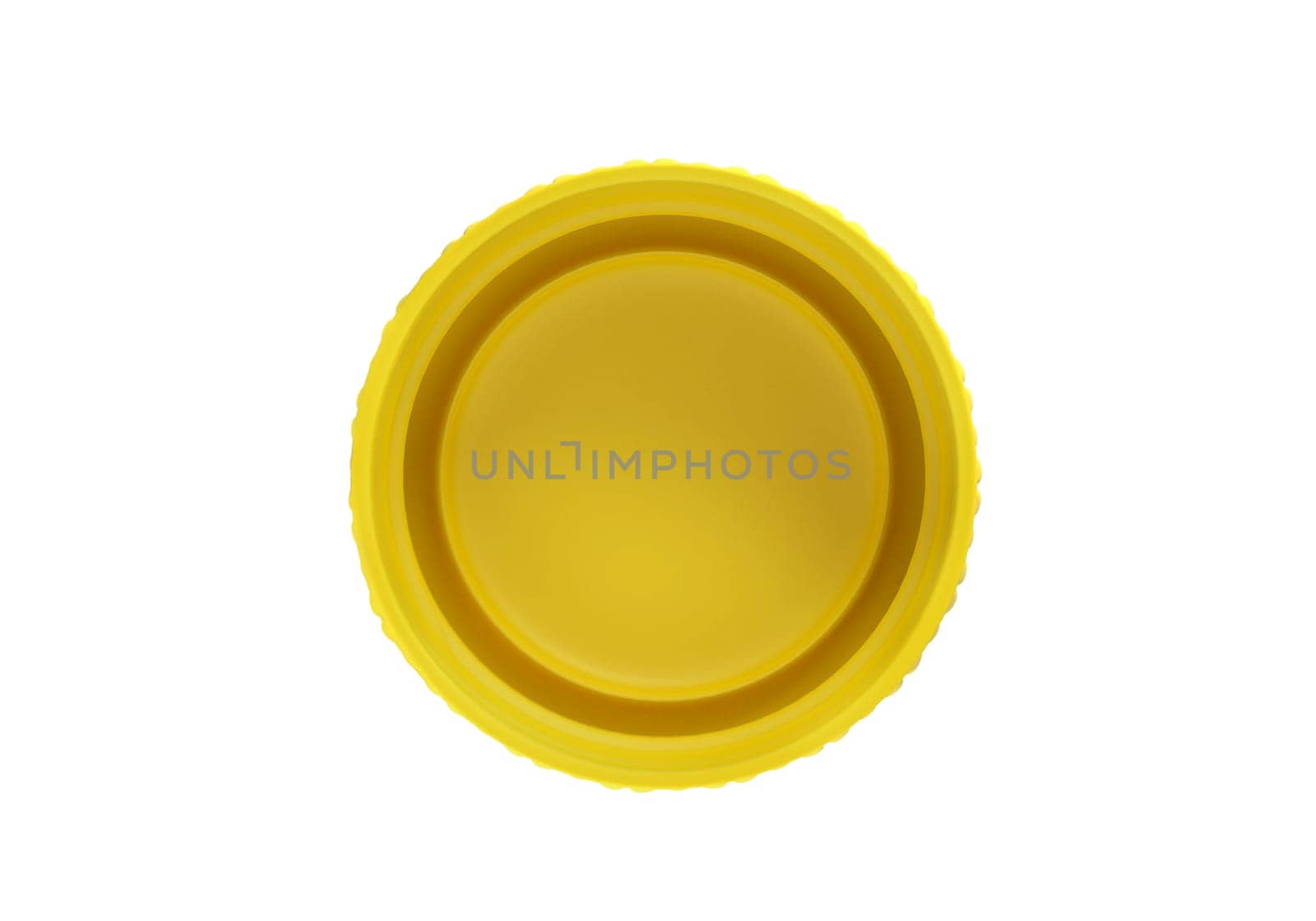 Yellow plastic bottle caps isolated on white background