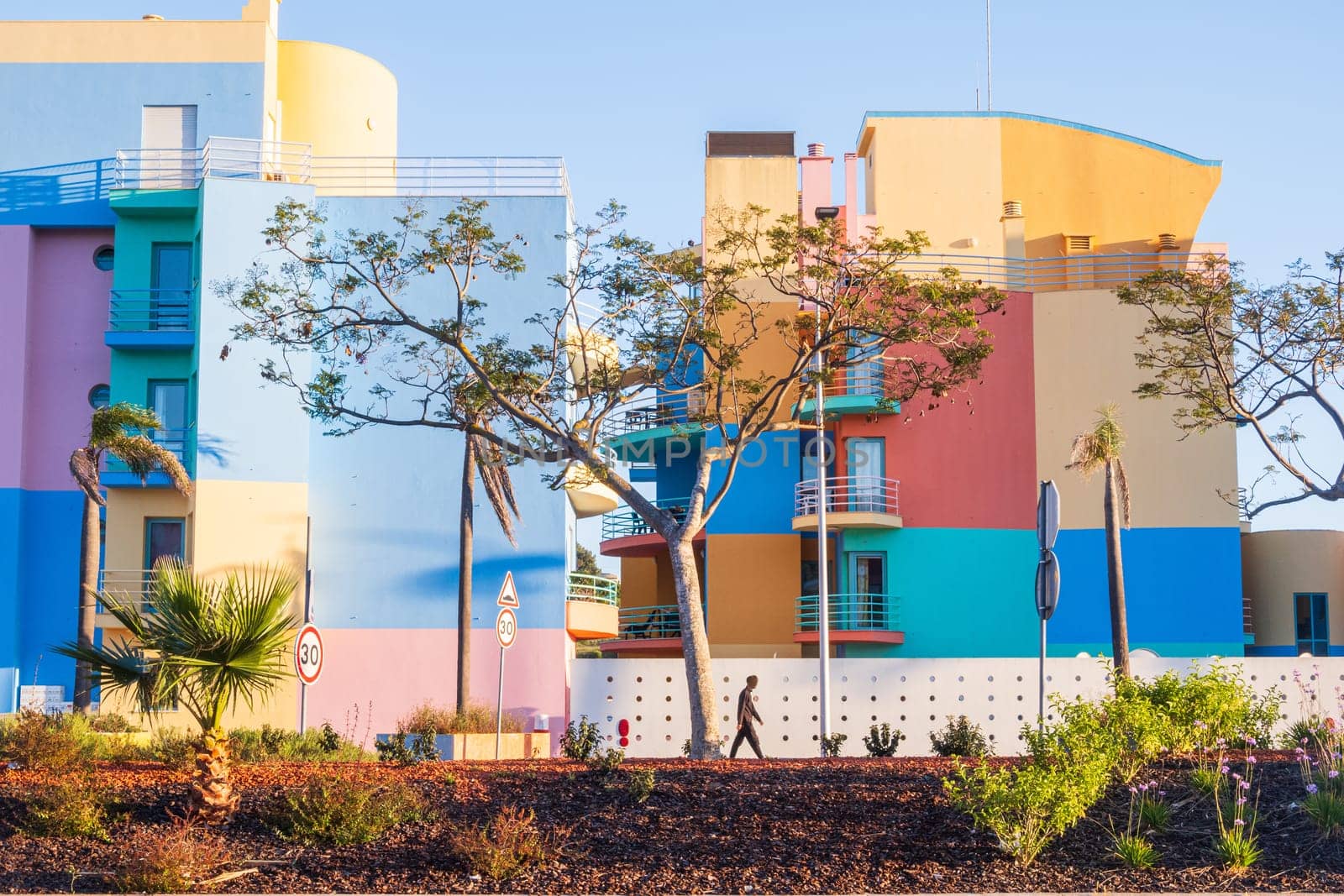 Albufeira, Portugal - April 28, 2024: Colorful buildings photographed from the street in the marina of Albufeira on the Algarve coast of Portugal