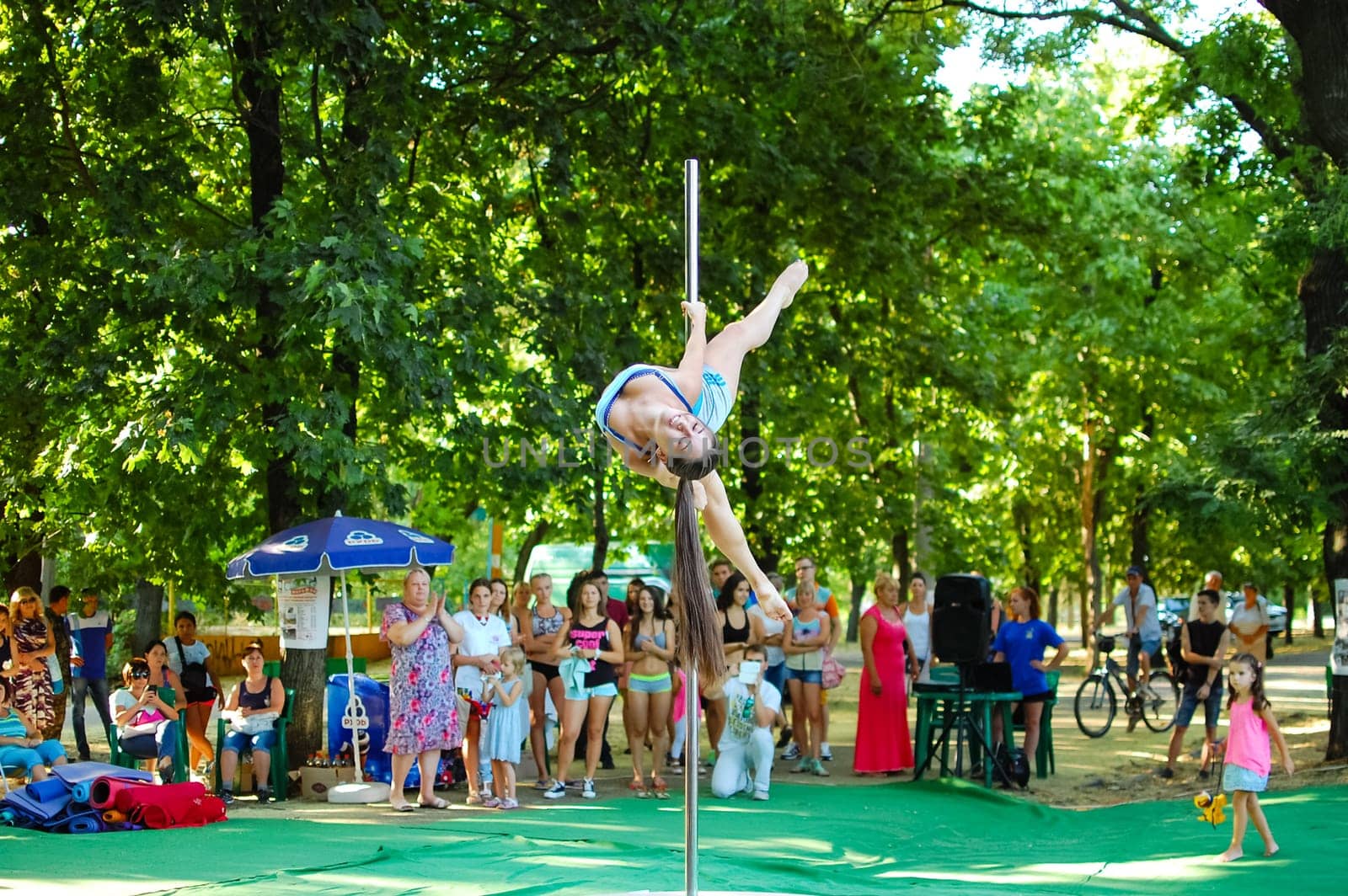 Russia, Volgodonsk - may 19, 2015: Exercises on a pole. Dancing on the pylon