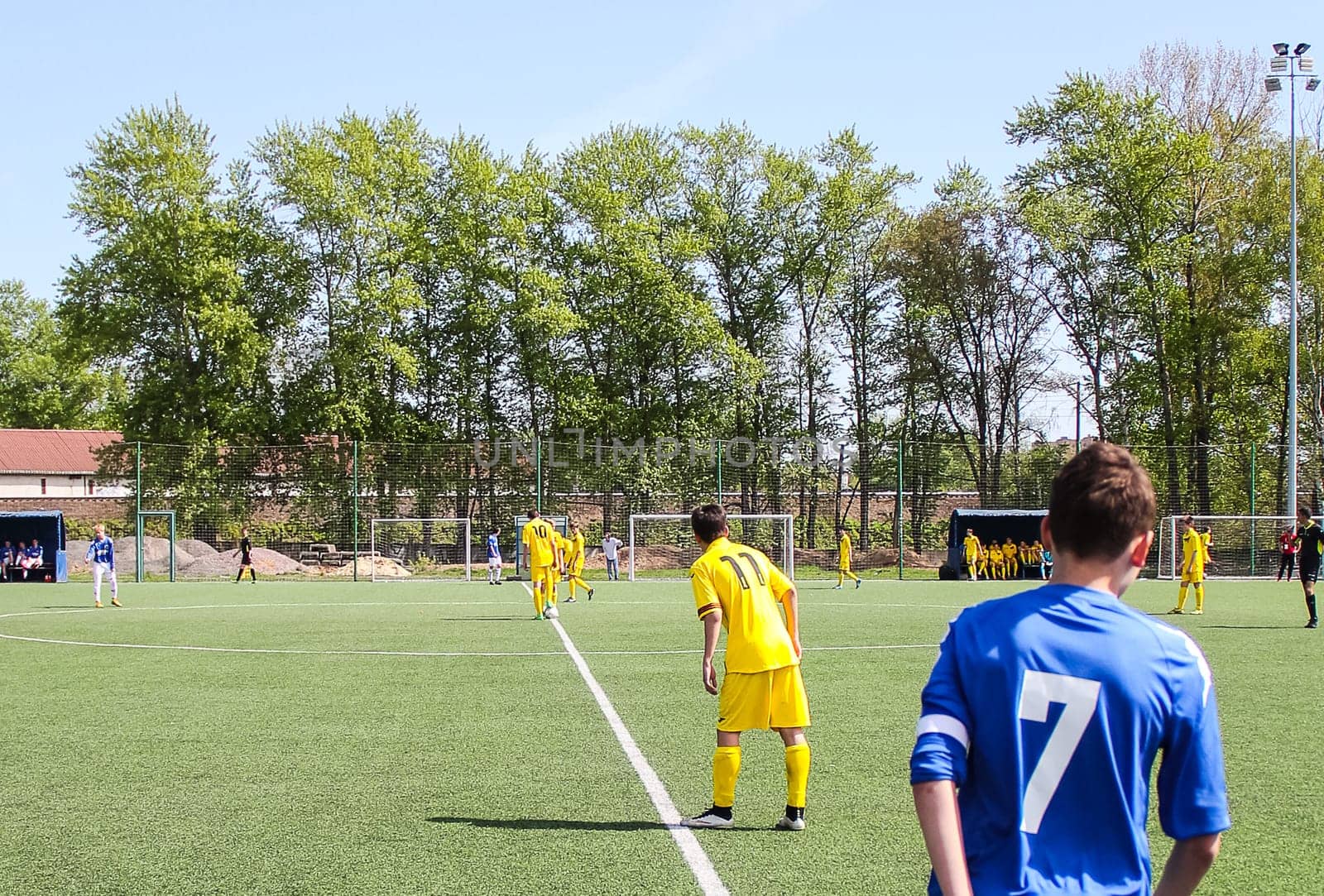 Russia, Volgodonsk - may 17, 2015: Football game. Training matches junior teams and fans