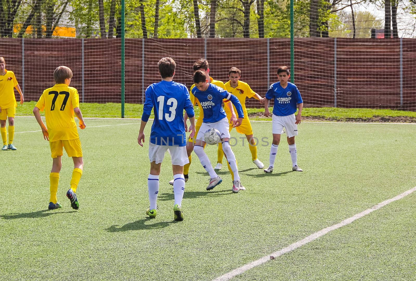 Russia, Volgodonsk - may 17, 2015: Football game. Training matches junior teams and fans