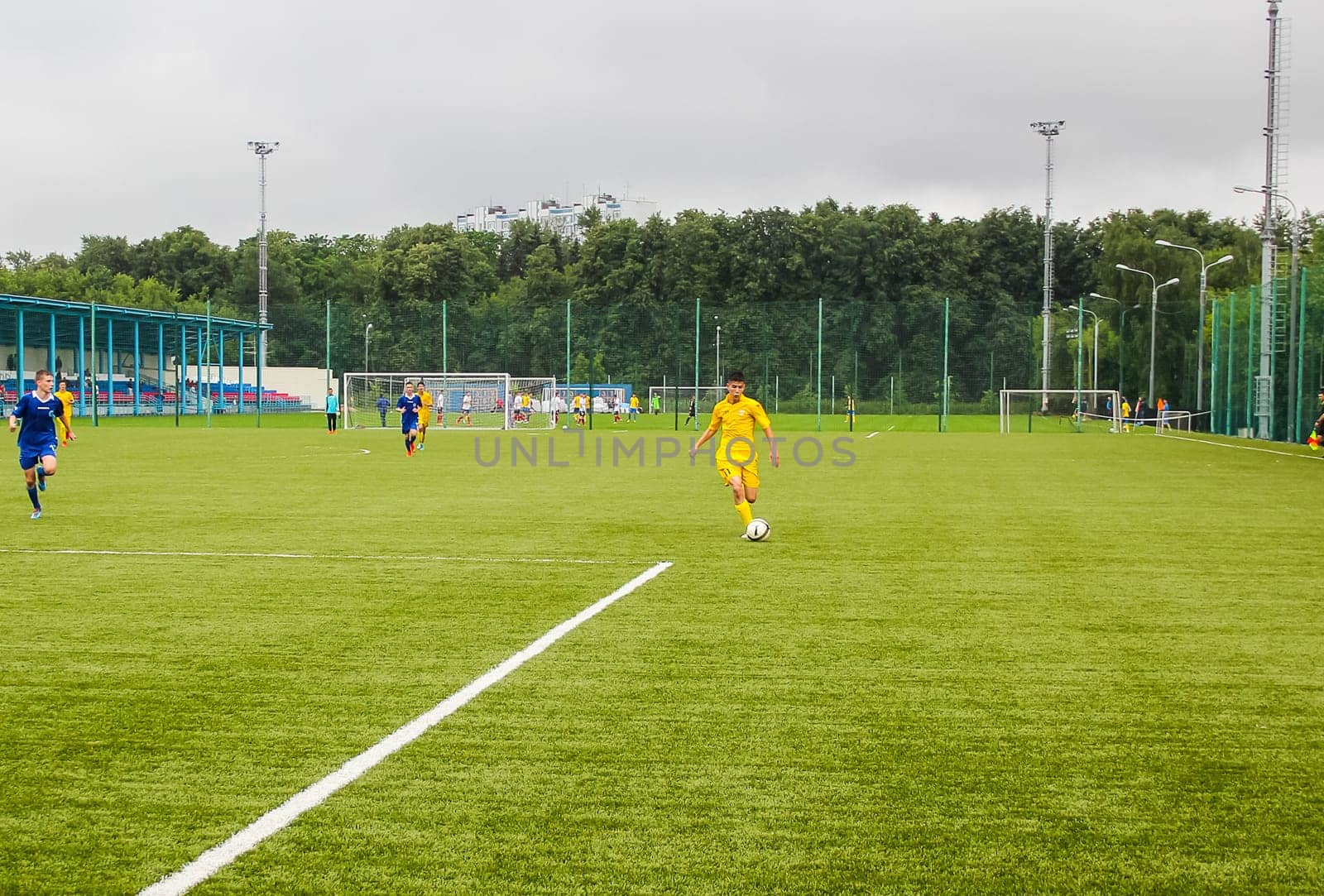 Russia, Volgodonsk - may 17, 2015: Football game. Training matches junior teams and fans