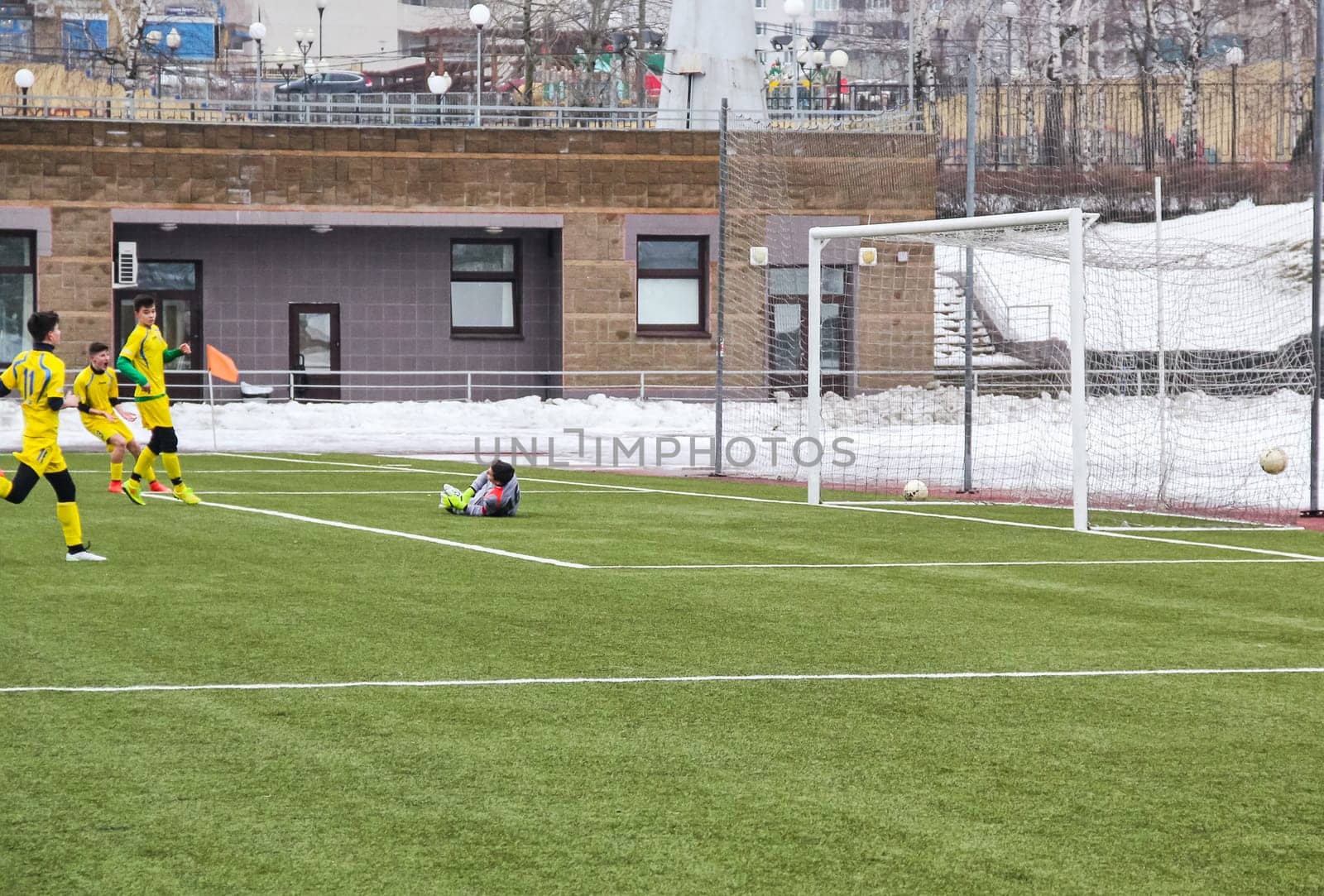 Russia, Volgodonsk - may 17, 2015: Football game. Training matches junior teams and fans