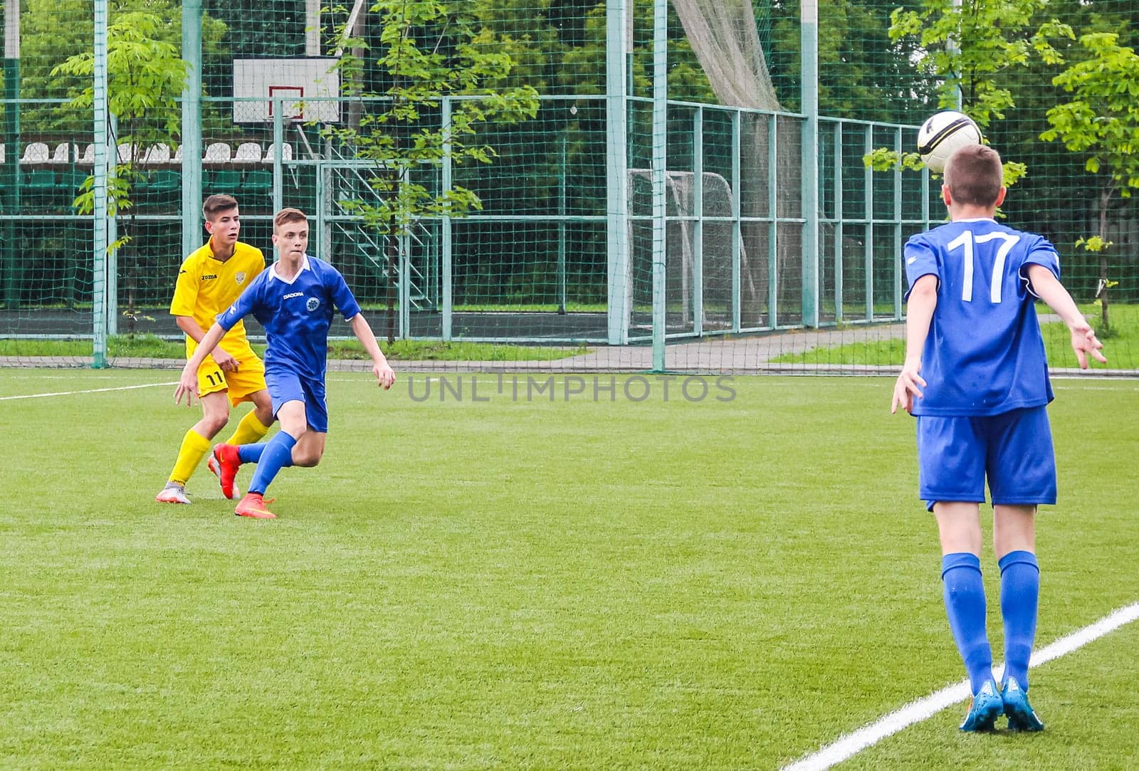 Russia, Volgodonsk - may 17, 2015: Football game. Training matches junior teams and fans
