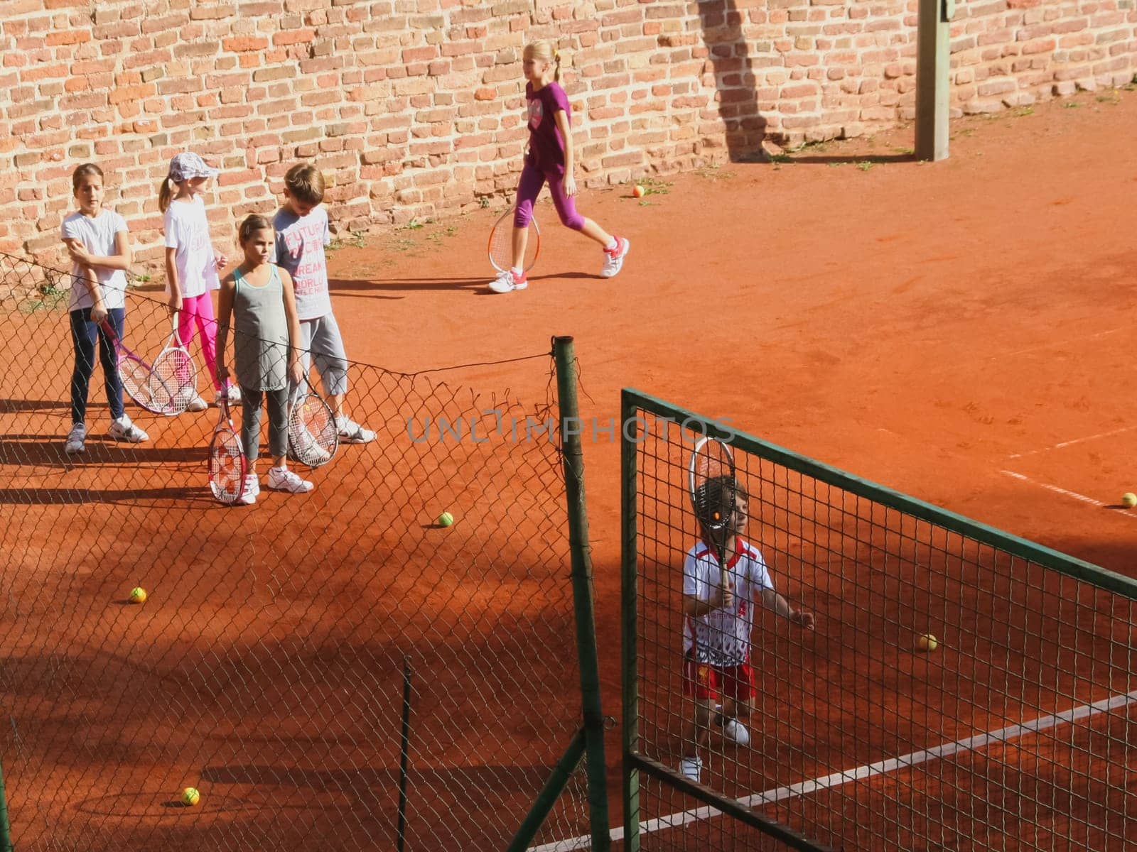 A child playing badminton. Yard games children.