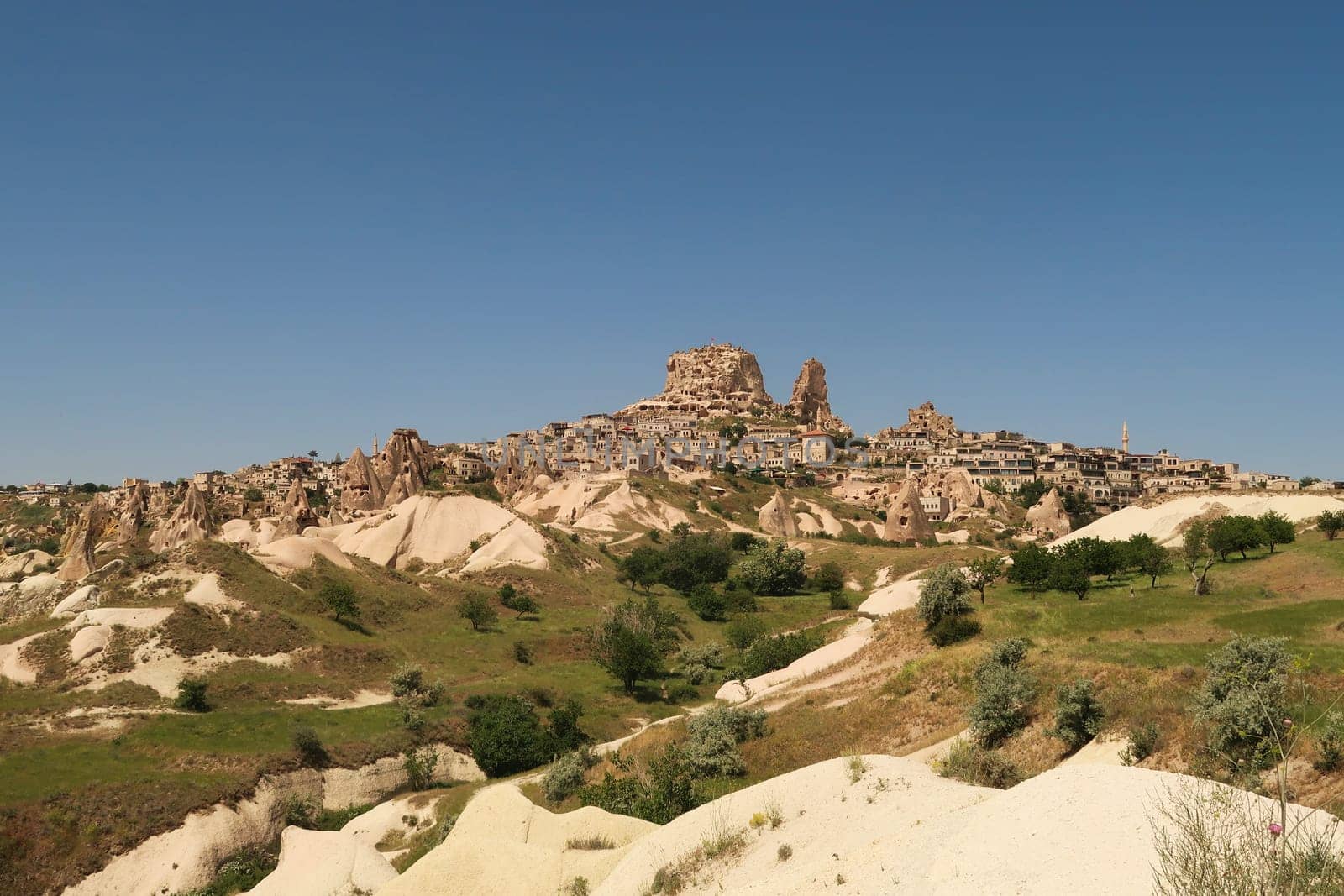 First view of Uchisar coming from Göreme through the Pigeon Valley, Güvercinlik Vadisi, Cappadocia, Turkey 2022