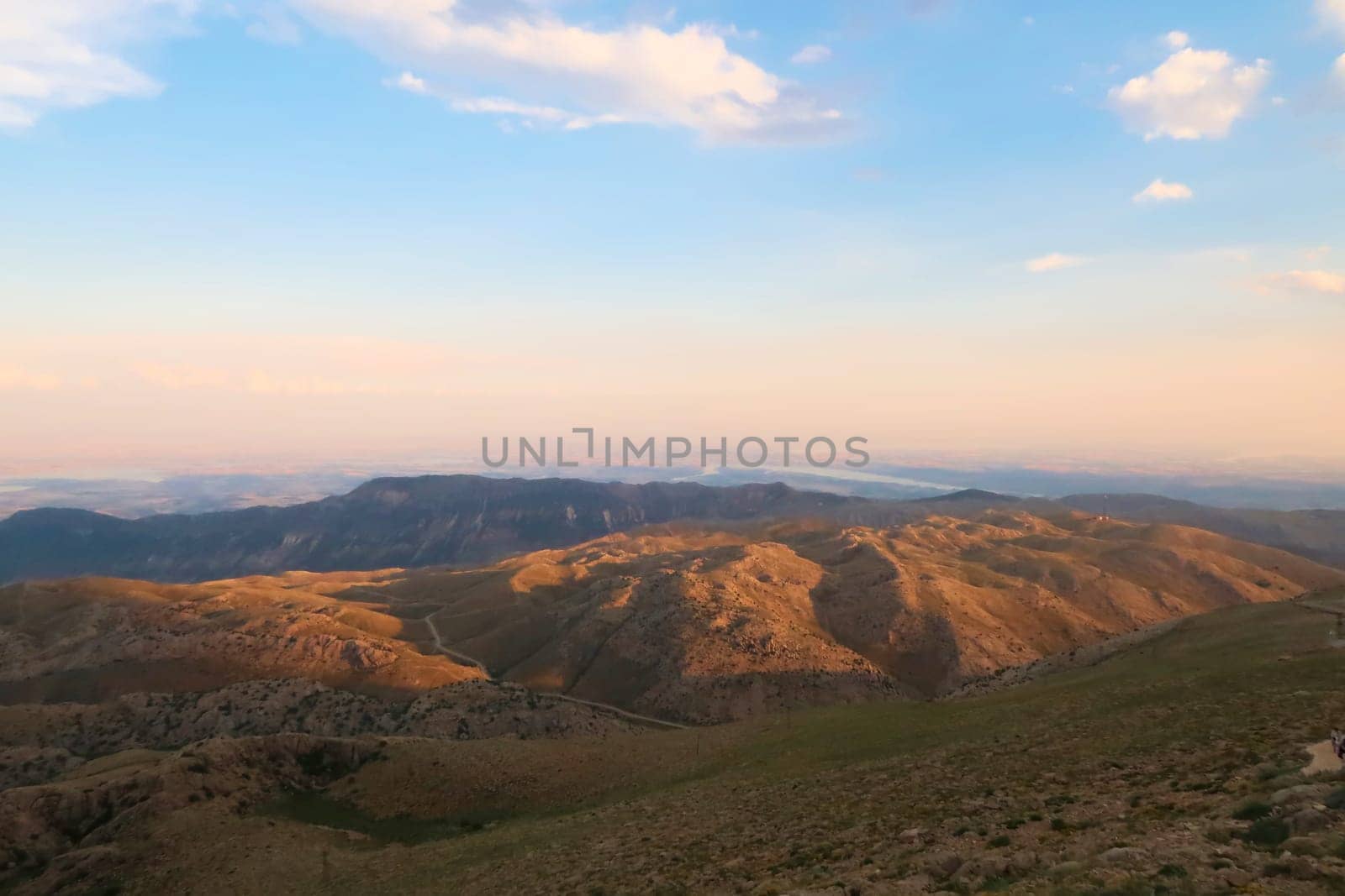 View from Mount Nemrut onto the surrounding landscape before sunset, the Atatürk Reservoir is visible in the background, close to Adiyaman, Turkey 2022