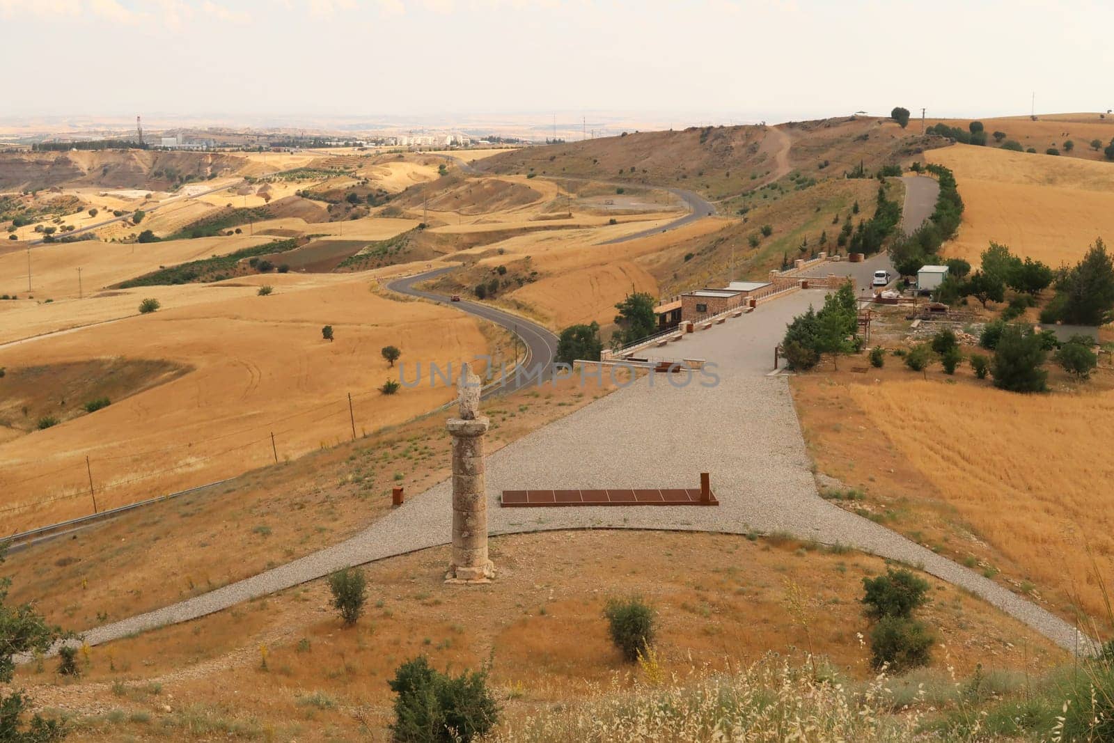 View from Karakus Tumulus, memorial grave of the Commagene Royal Family onto the surrounding landscape with the entrance area in the foreground, close to Adiyaman, Turkey 2022