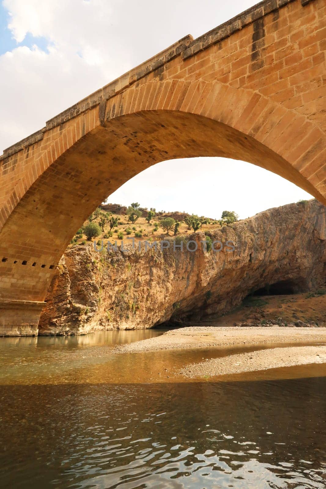 Looking up to the Severan, Cendere Bridge from below, roman bridge close to Adiyaman, Turkey 2022