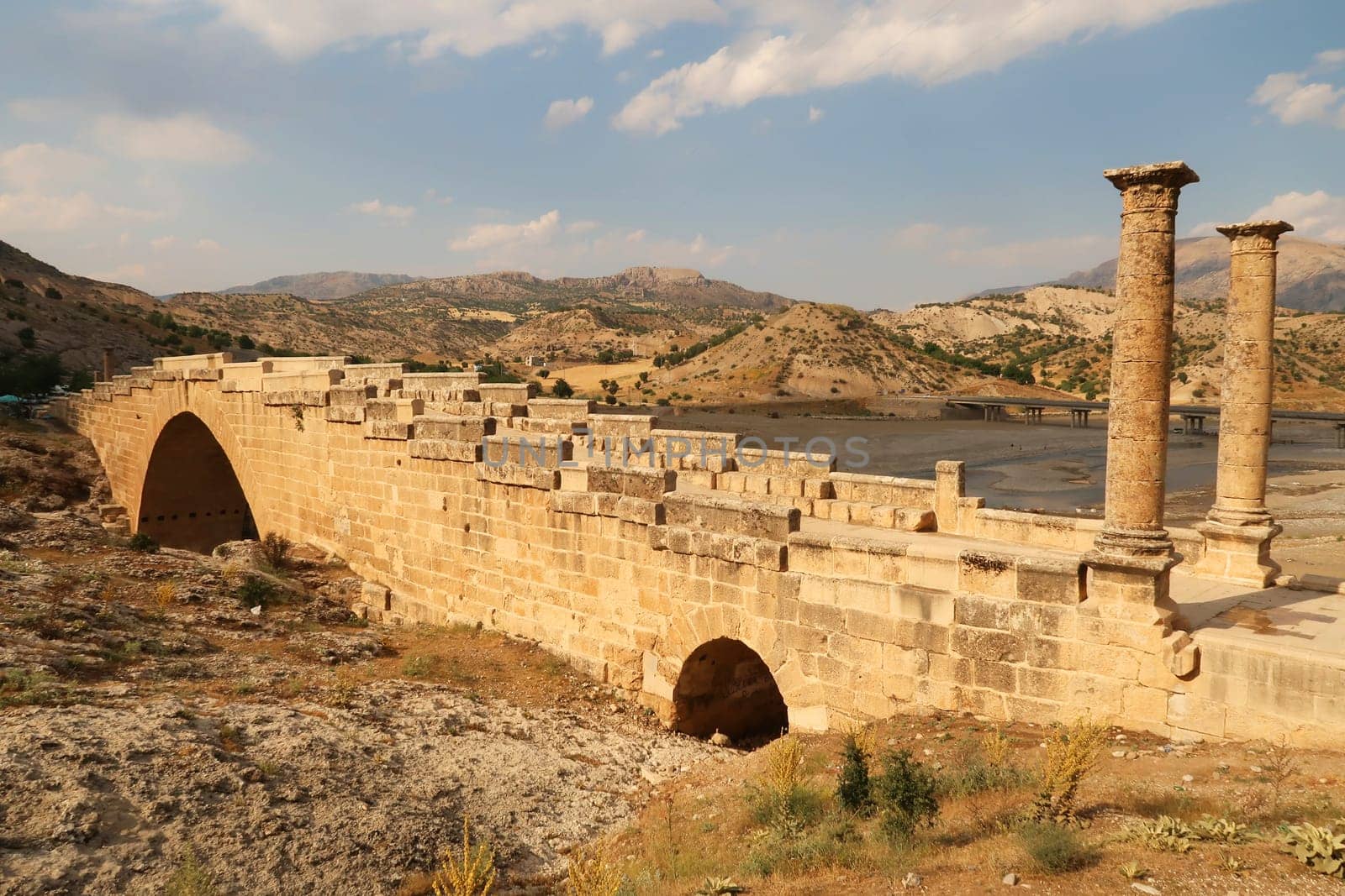 View from above onto the beautiful Severan, Cendere Bridge, a column on the left, close to Adiyaman, Turkey 2022