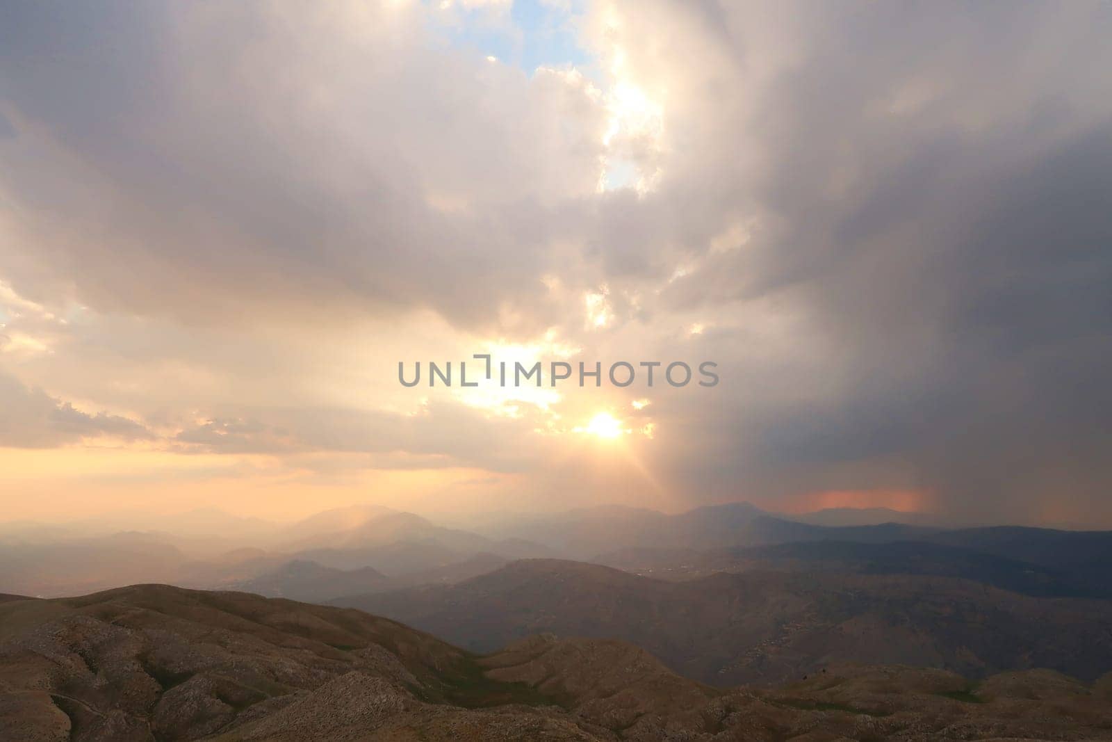 View from Mount Nemrut onto the surrounding landscape before sunset on a cloudy day, close to Adiyaman, Turkey 2022
