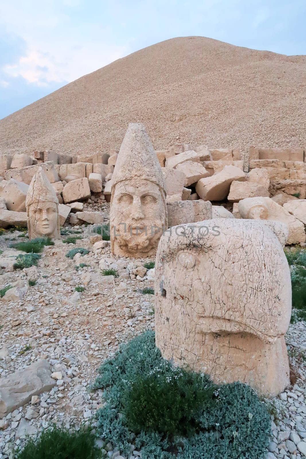 Heads of stone statues, sculptures on the West Terrace of Mount Nemrut, heads Apollo, Zeus and an eagle, close to Adiyaman, Turkey 2022