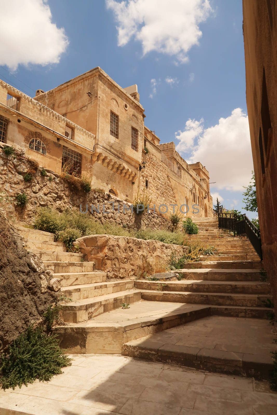Stairs leading into a hilly traditional neighborhood of Mardin, Turkey 2022