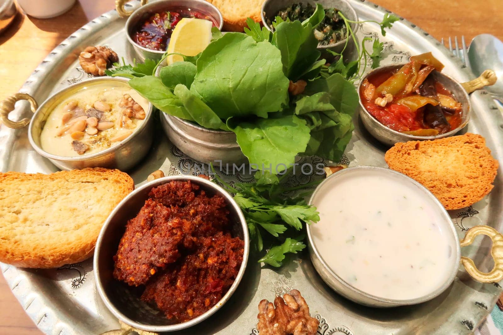 Big mezze, meze platter with served in a traditional restaurant in the old town of Mardin, Turkey 2022
