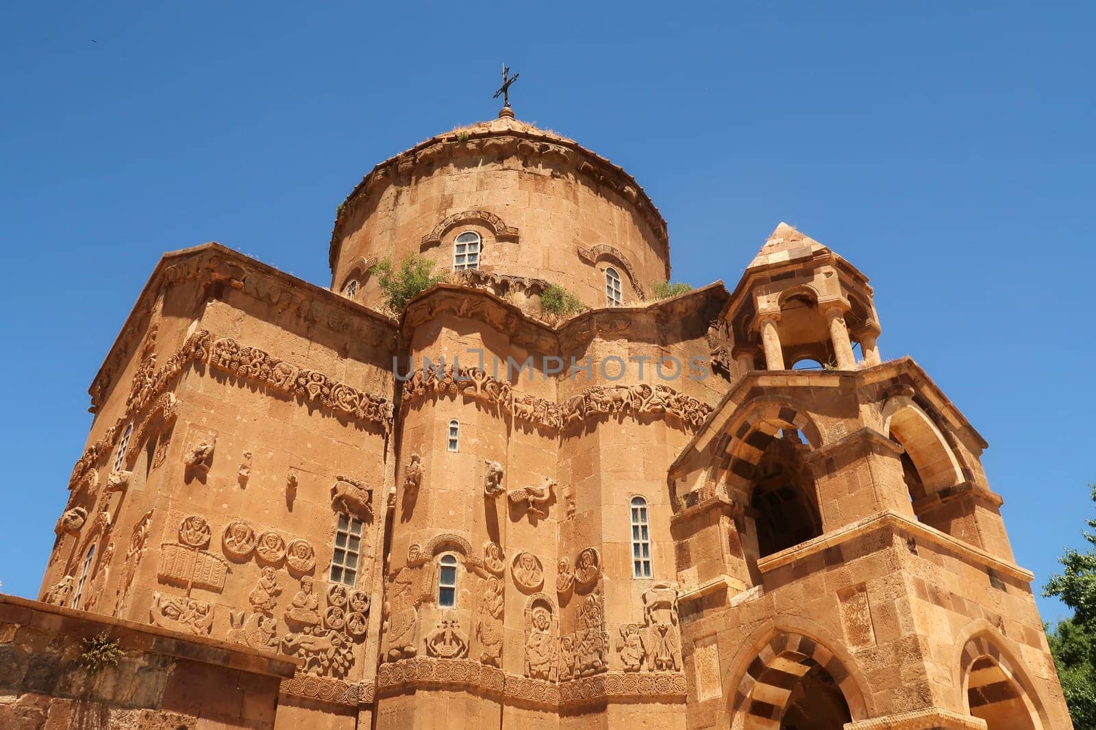 Closer look on the front facade of the Armenian Cathedral of the Holy Cross on Akdamar Island on Lake Van, Van Gölü, with its elaborate bas-relief, relief carvings, Van, Turkey 2022