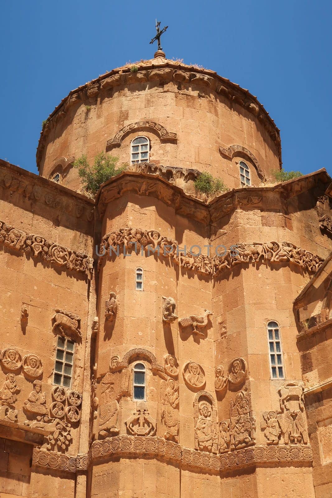 The elaborate bas-relief, relief carvings on the facade of the Armenian Cathedral of the Holy Cross showing biblical scenes, Akdamar Island, Lake Van, Van Gölü, Van, Turkey 2022