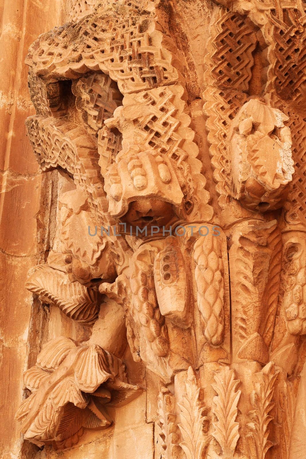 Elaborate floral, flower bouquet, plant carvings next to the majestic gate, doorway in the second court inside the Ishak Pasha Palace, Sarayi, Dogubeyazit, Turkey 2022