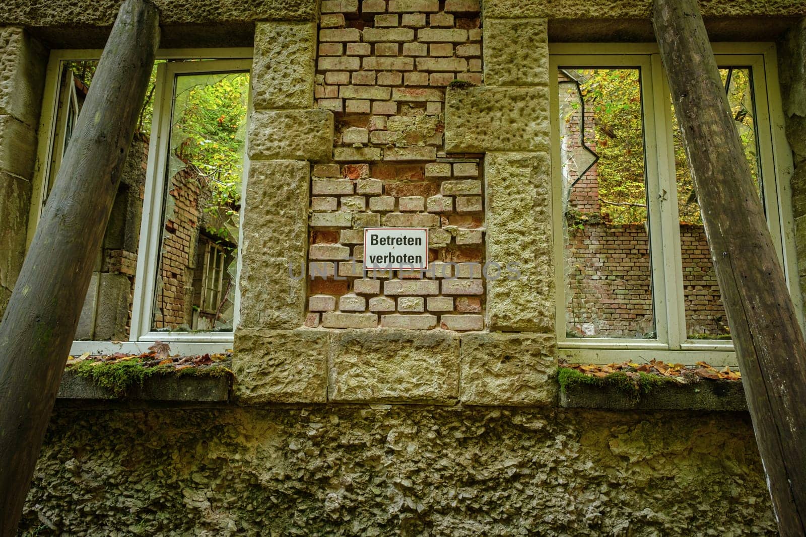 Wall and windows of an old lost place power plant building
