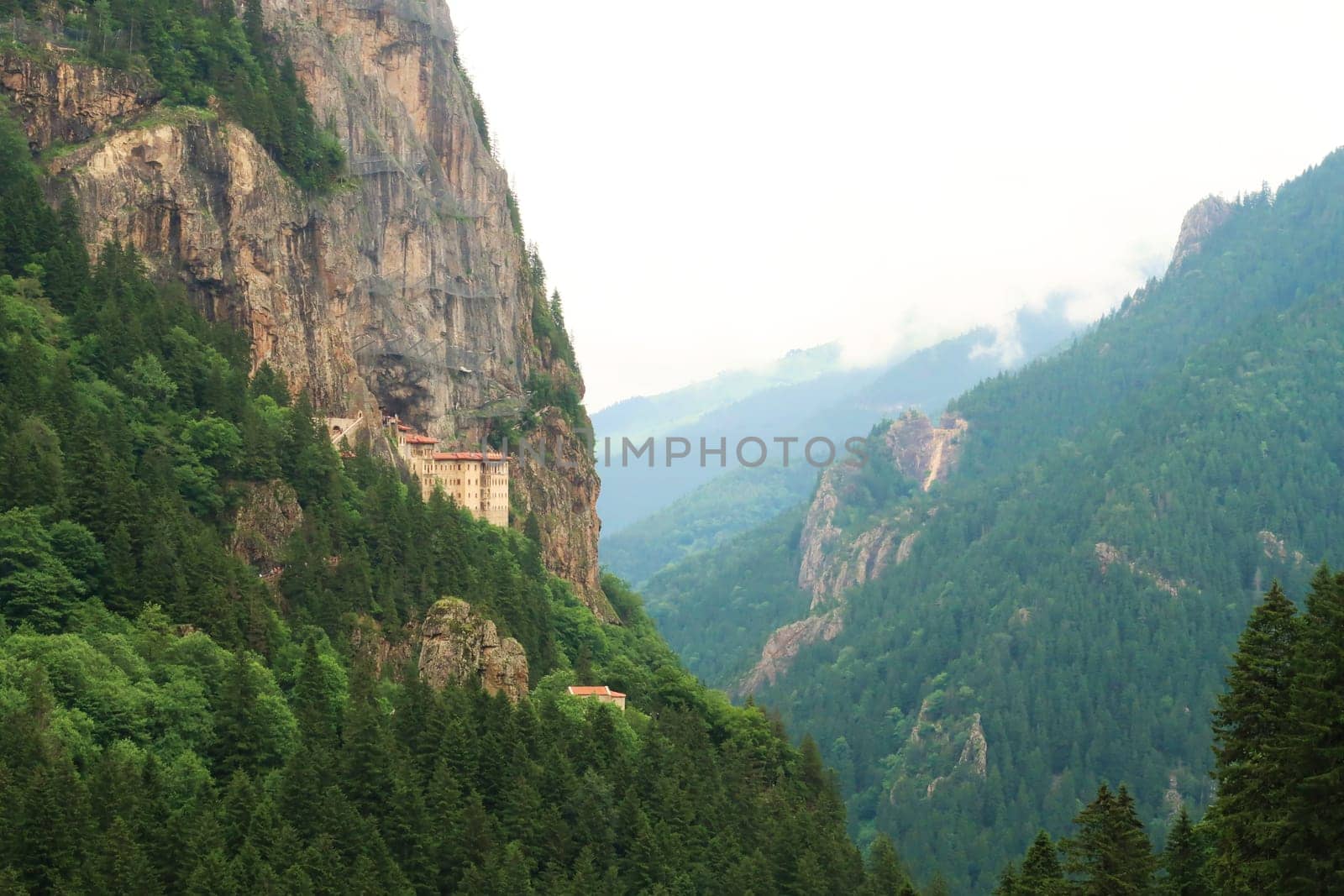 Spectacular view onto the Sumela, Sümela Monastery, built on a cliff above a dense forest next to a gorge, Trabzon, Turkey 2022