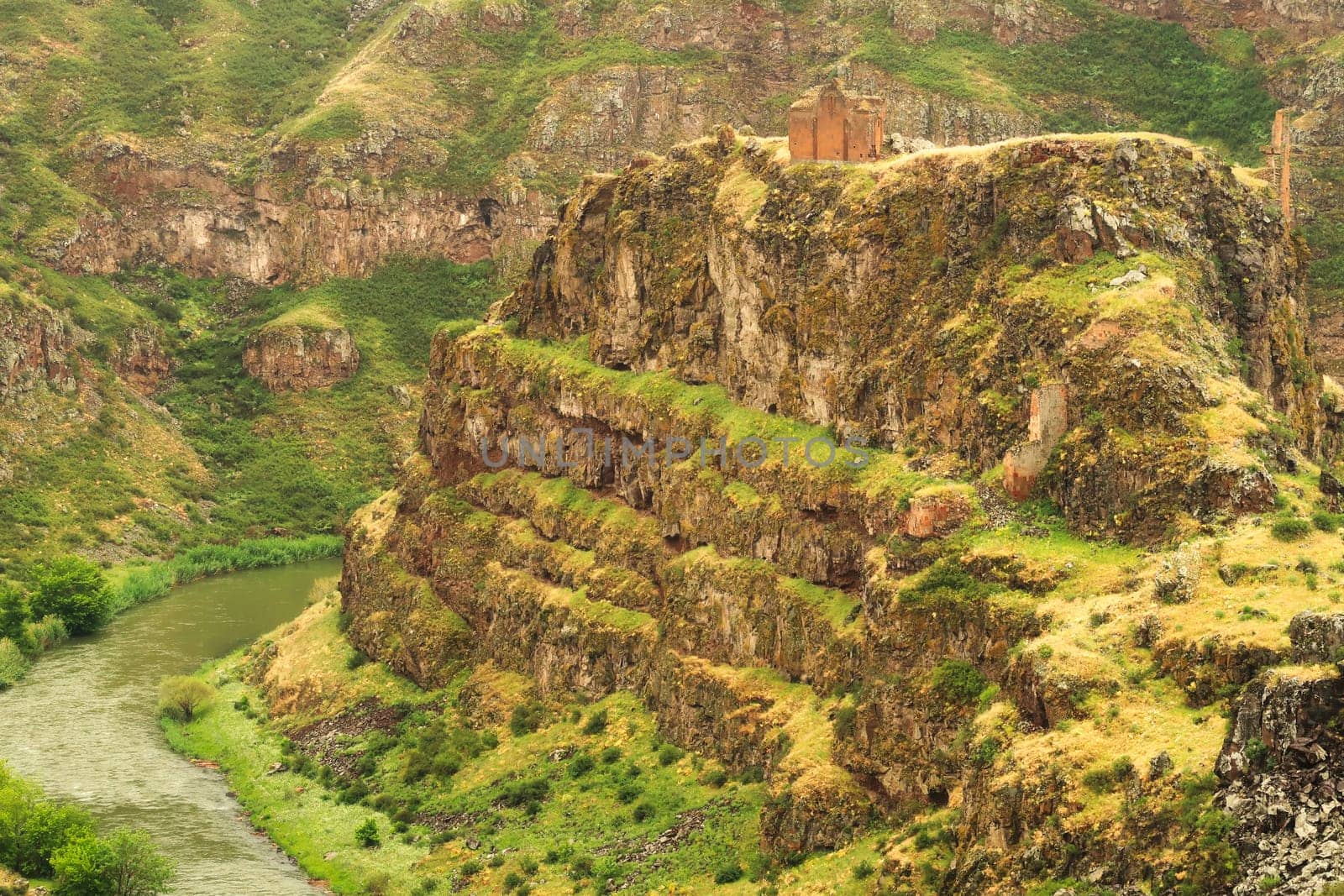 The promontory encircled by the canyon of the Akhurian River with the ruins of the Church of Saint Elia, Zakares Church on top, last remaining building of the Kizkale, Kiz Kalesi, Maidens, Virgins Castle, ancient site of Ani, Kars, Turkey 2022