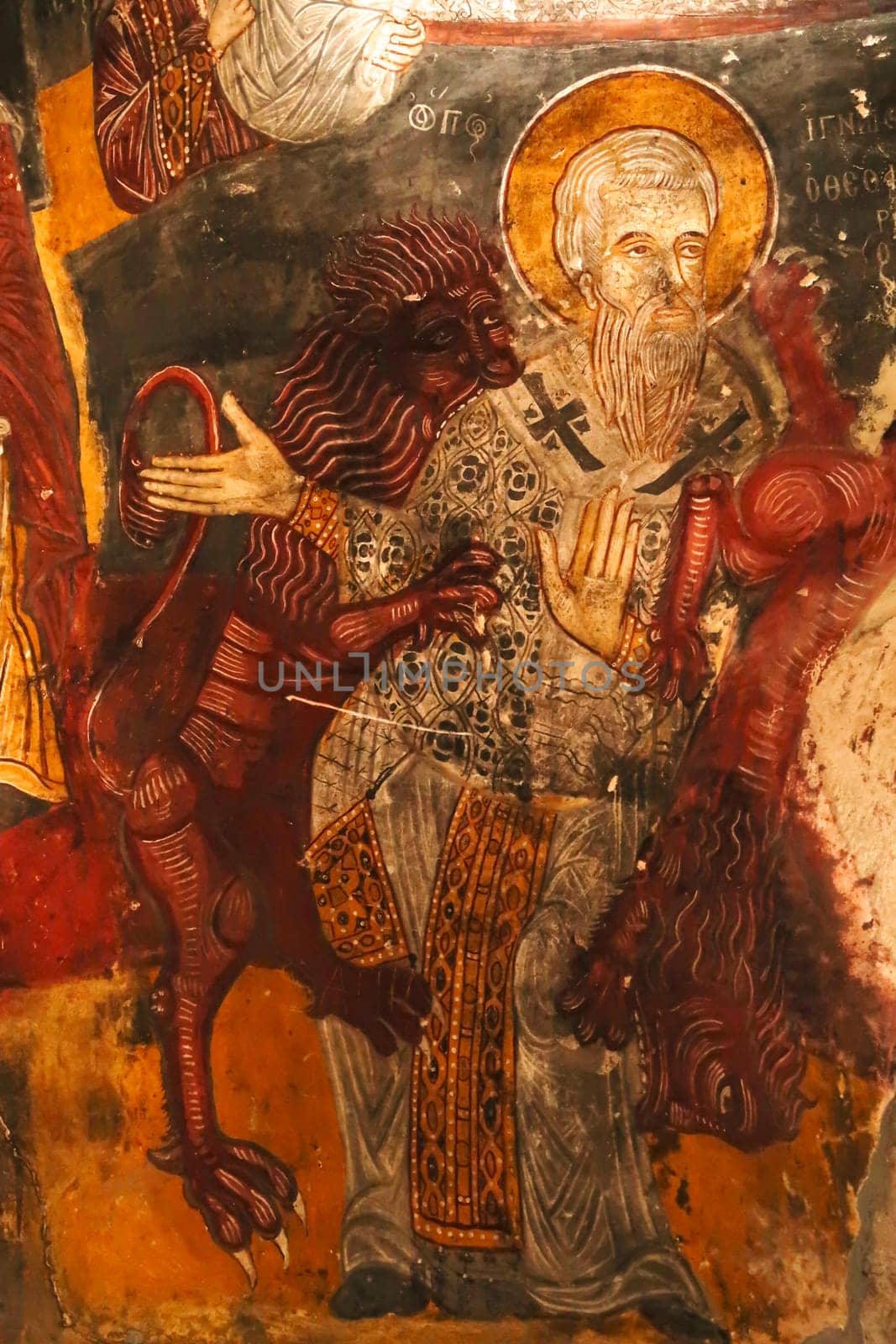 Colorful ceiling painting, fresco, wall painting showing St. Ignatius of Antioch being eaten by lions inside the Rock Church at Sumela, Sümela Monastery, Trabzon, Turkey 2022