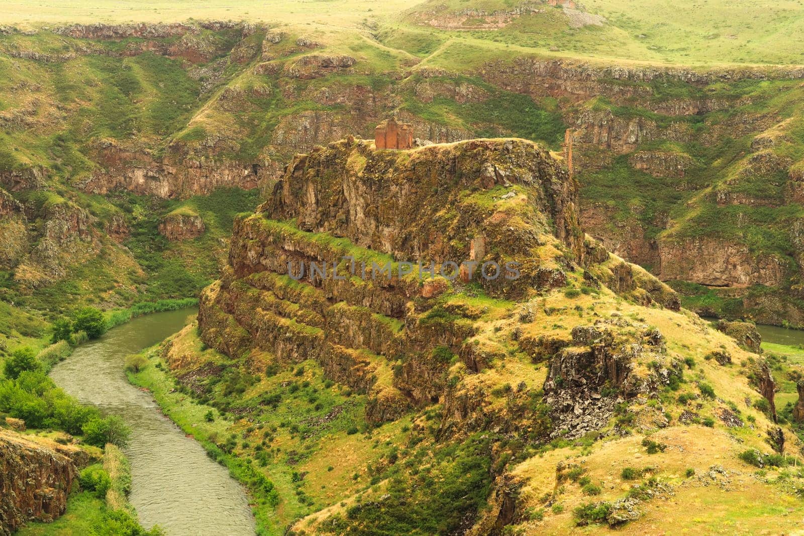 View from the citadel on the promontory encircled by the canyon of the Akhurian River with the ruins of the Church of Saint Elia, Zakares Church on top, last remaining building of the Kizkale, Kiz Kalesi, Maidens, Virgins Castle, ancient site of Ani, Kars, Turkey 2022