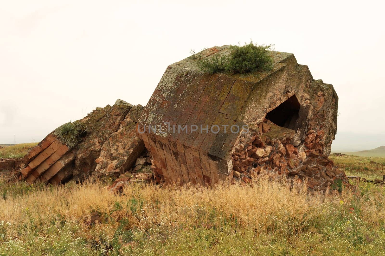 The ruins of the fallen minaret at the ancient site of Ani, an abandoned ruined armenian city, close to Kars, Turkey 2022