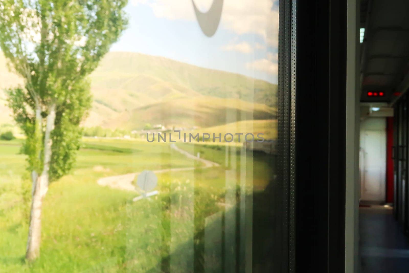 The picturesque landscape seen on the train ride in the Eastern Express, Dogu Ekspresi from Kars to Ankara, the interior of the train and its front are both visible, Turkey 2022