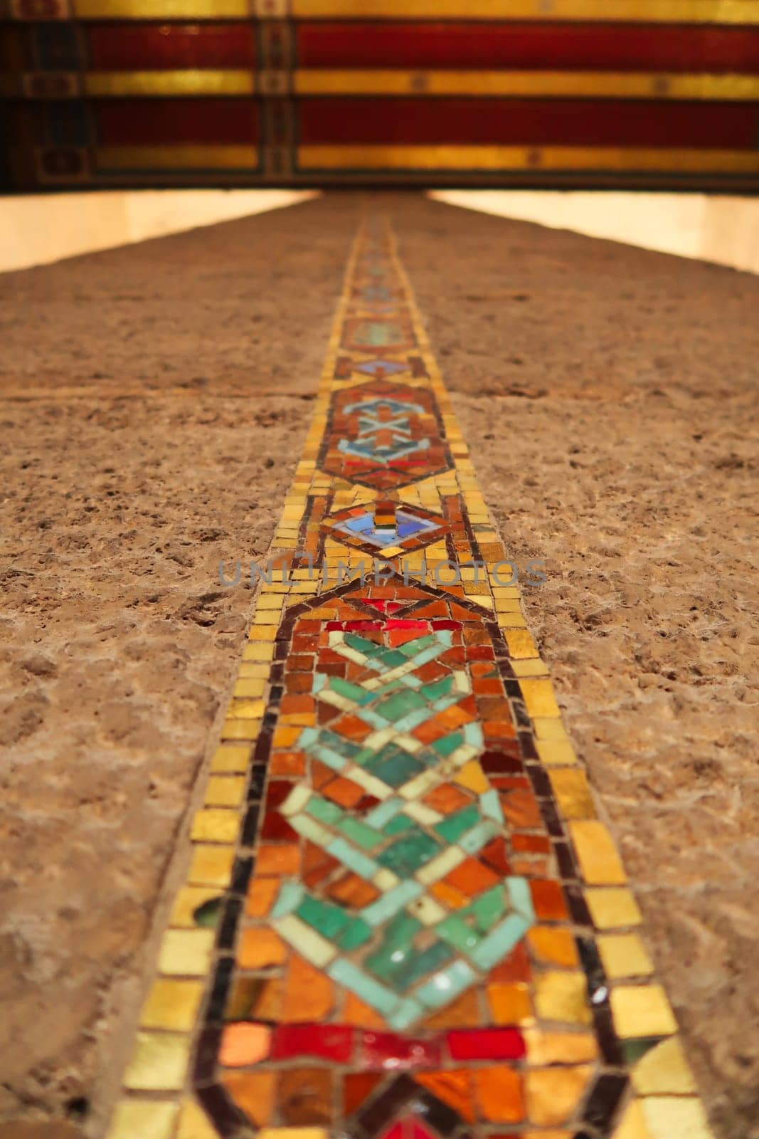Elaborate and colorful strip of mosaic running on the columns to the gold and red ceiling inside the Hall of Honor, the mausoleum that houses the tomb of Mustafa Kemal Atatürk, Ataturk at the Anitkabir monument, memorial, complex, Ankara, Turkey 2022