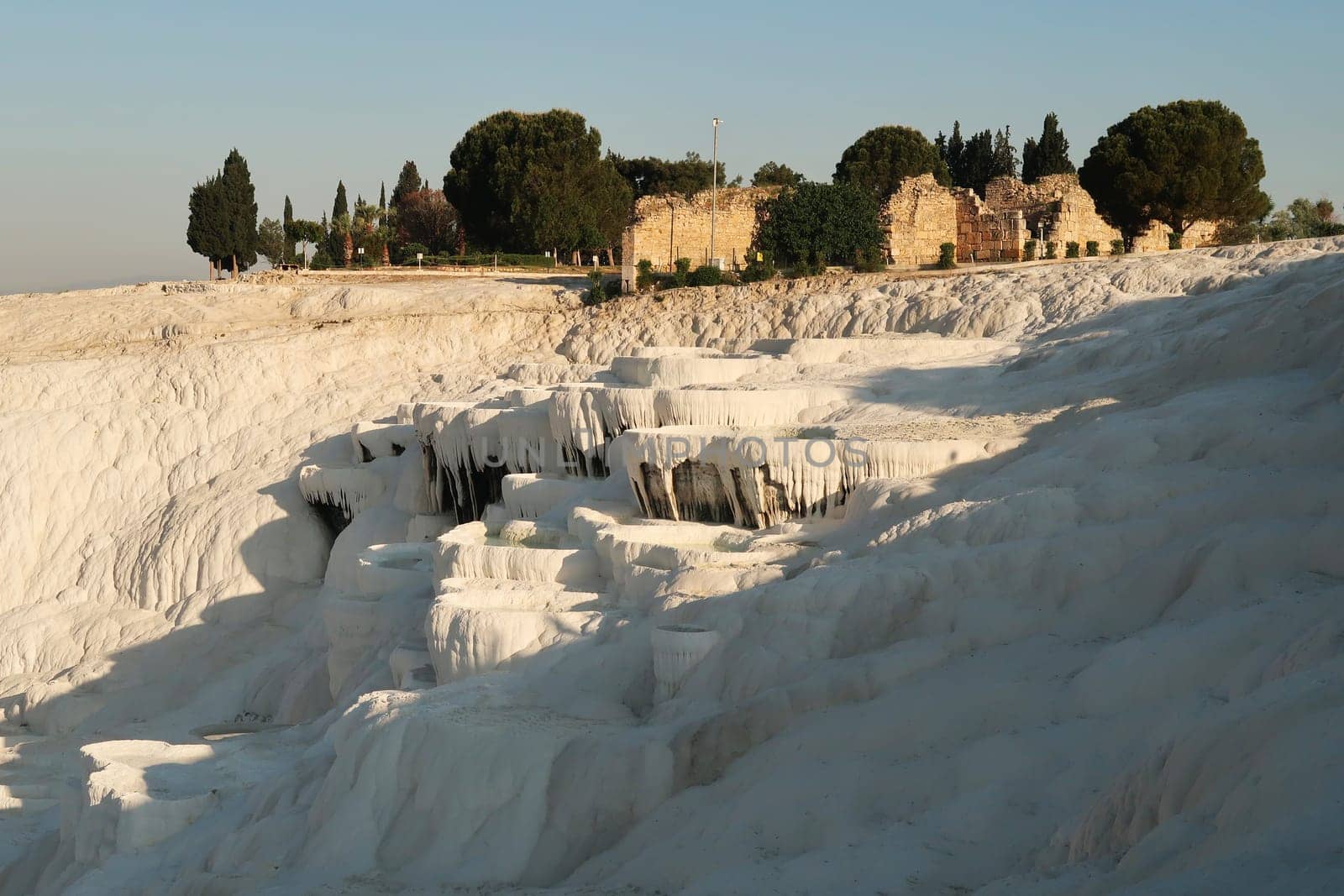 The impressive travertine terraces at Pamukkale in the early morning, Denizli, Turkey 2022
