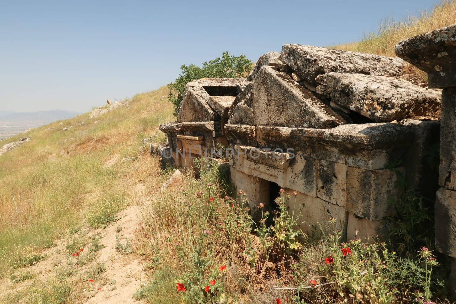 Row of three sunken tombs at the upper Necropolis of the ancient site of Hierapolis, Pamukkale, Denizli, Turkey 2022
