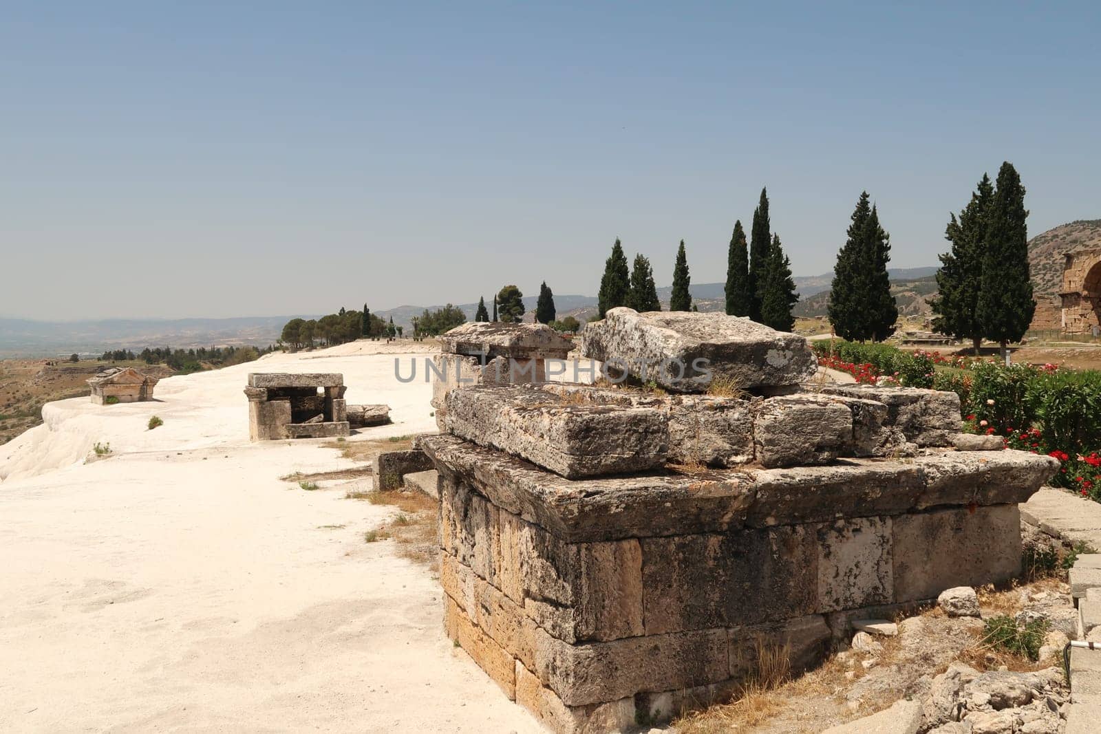 Tomb at the ancient site of Hierapolis sunken submerged in the limestone deposits of the travertines, Pamukkale, Denizli, Turkey 2022