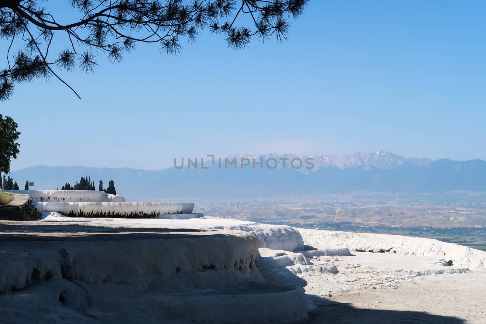 Fantastic view from the travertines of Pamukkale with the valley and the mountains in the background, Denizli, Turkey 2024