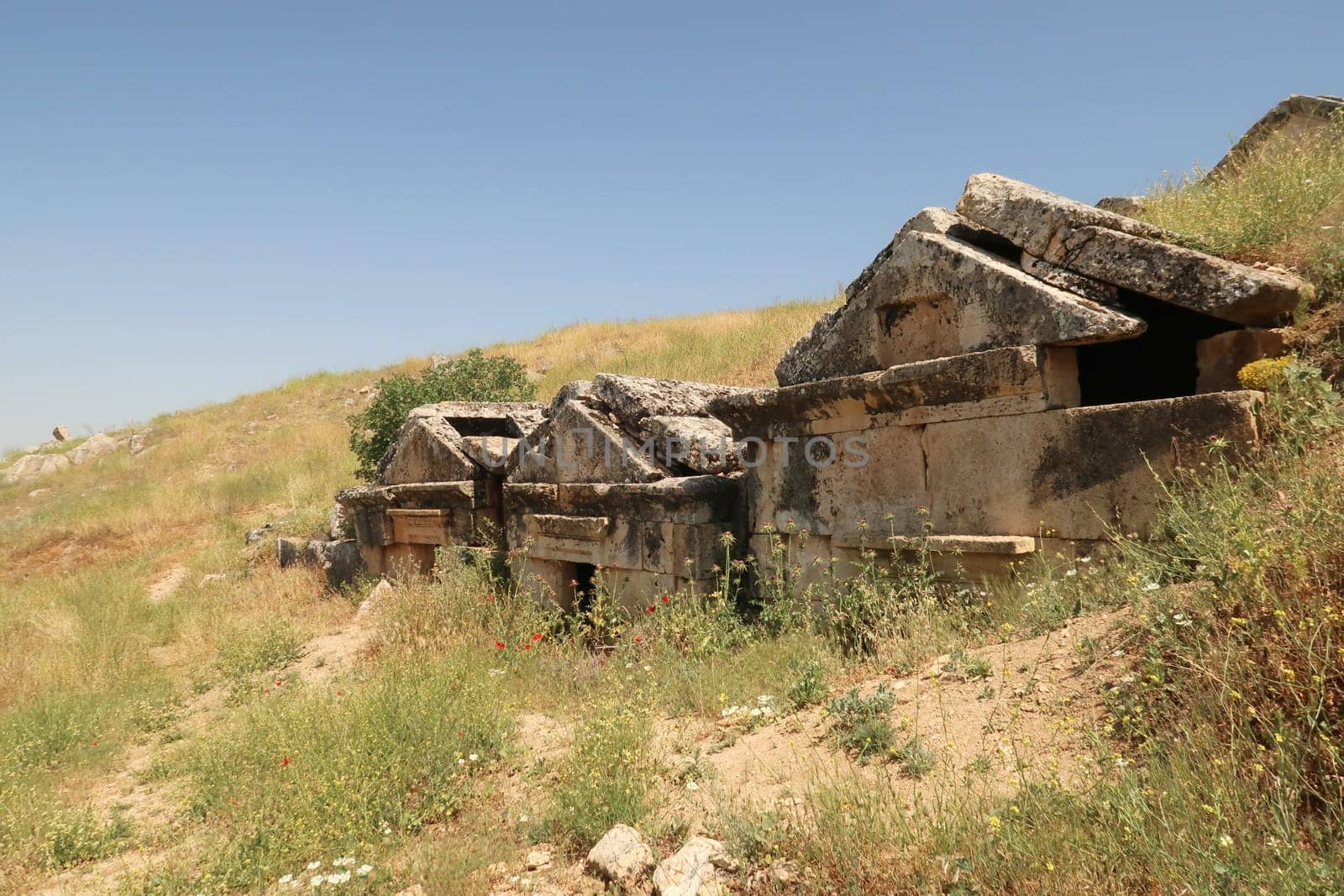 Row of three ancient tombs at the upper Necropolis of the archaeological site of Hierapolis, Pamukkale, Denizli, Turkey 2022