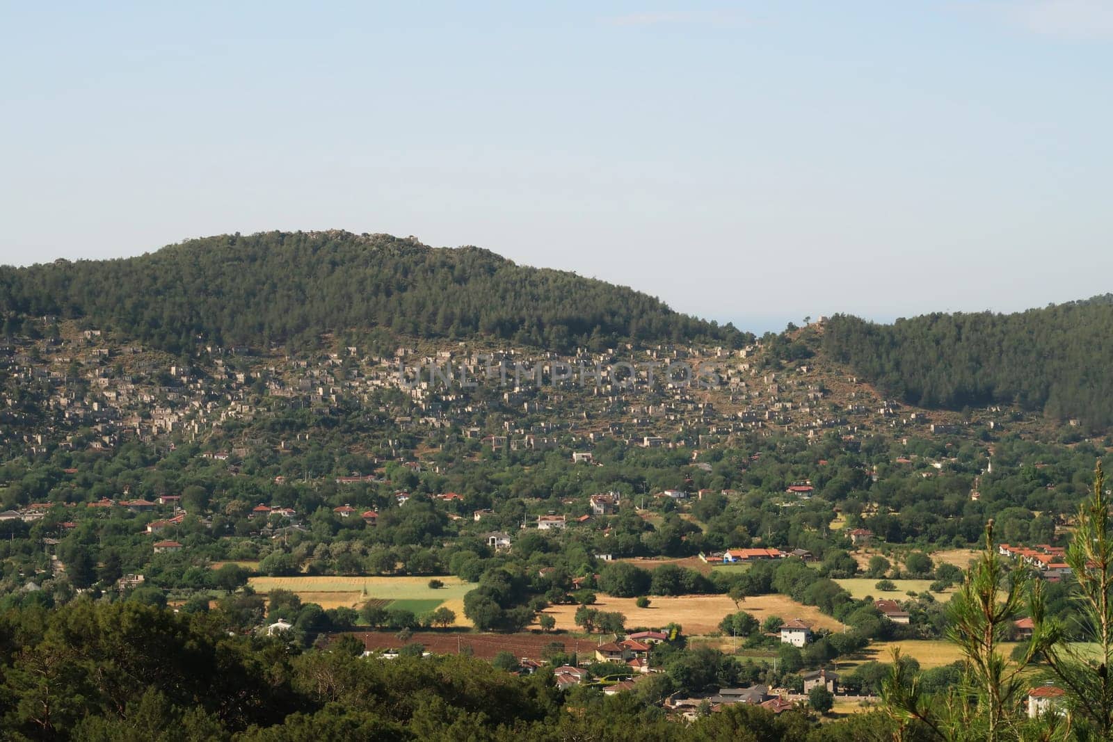 View from the distance on the abandoned village of Kayaköy, Livissi, close to Fethiye, Turkey 2022