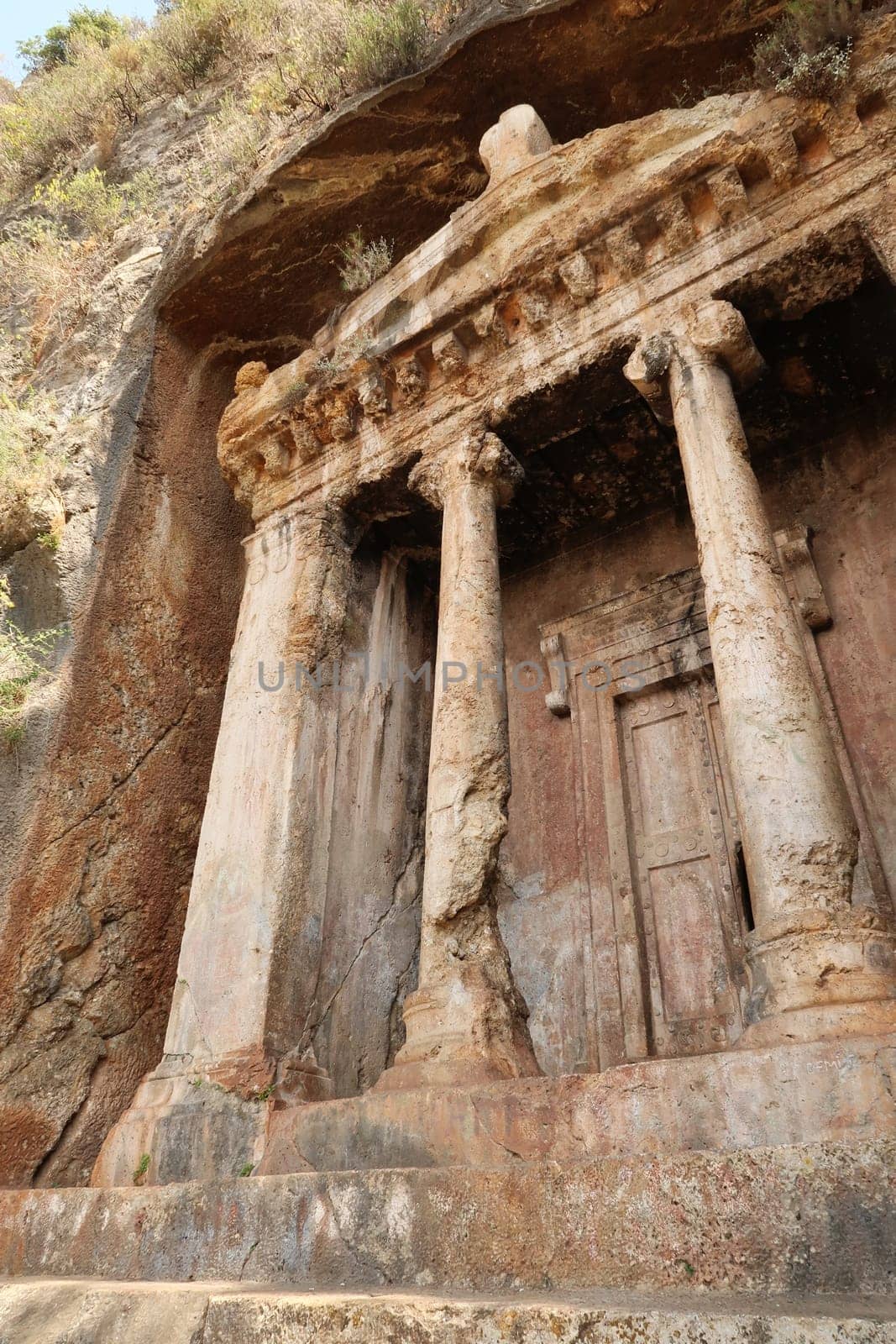 The rock-hewn, rock-cut ancient lycian tomb of Amyntas in former Telmessos, close to nowadays Fethiye, Turkey 2022