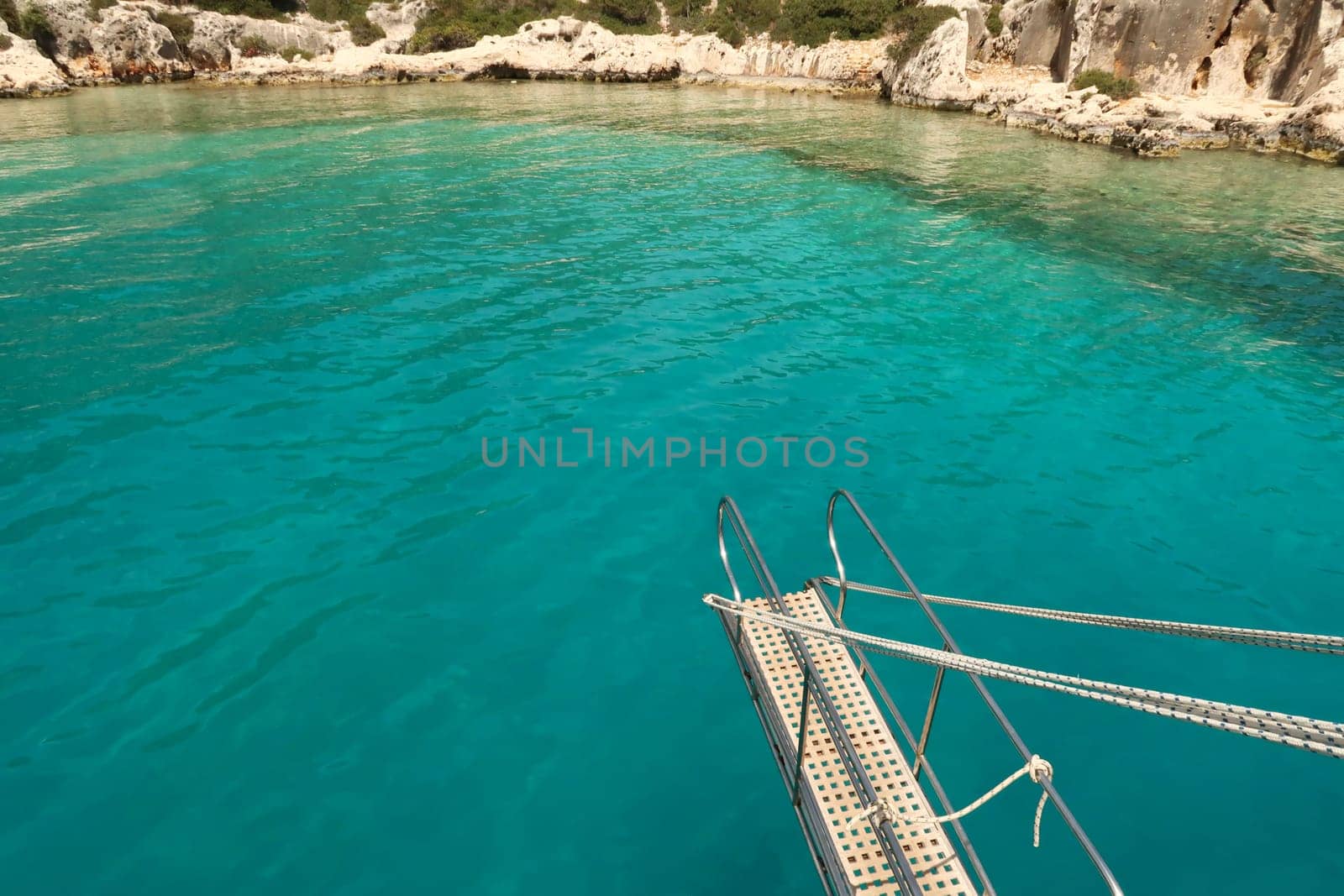 Diving into the turquoise blue sea of the Esmeralda Emerald Bay on our Kekova Island boat tour, near Demre, Turkey 2022