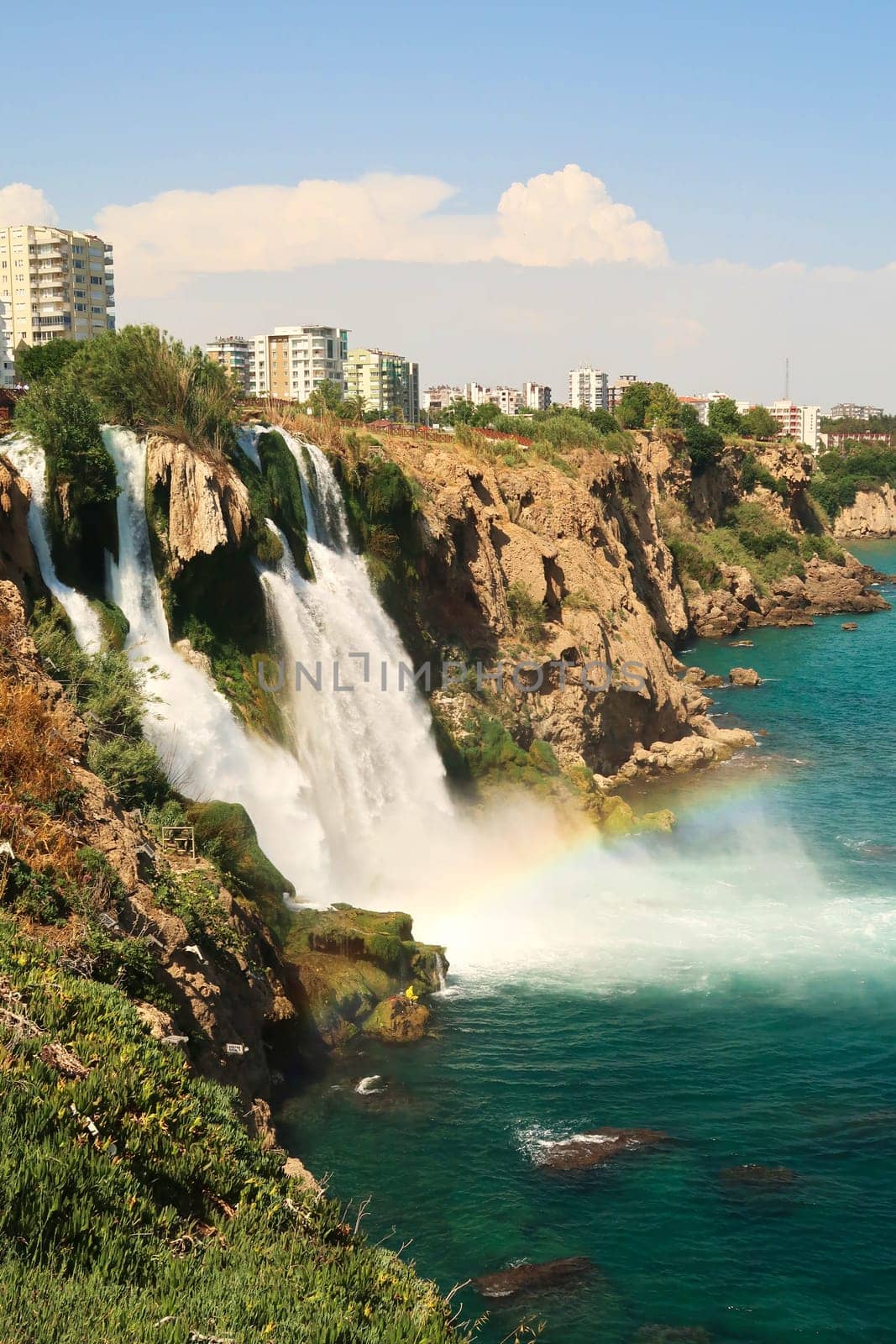 The majestic Lower Düden Waterfalls in Antalya with a rainbow right next to them, Antalya, Turkey 2022