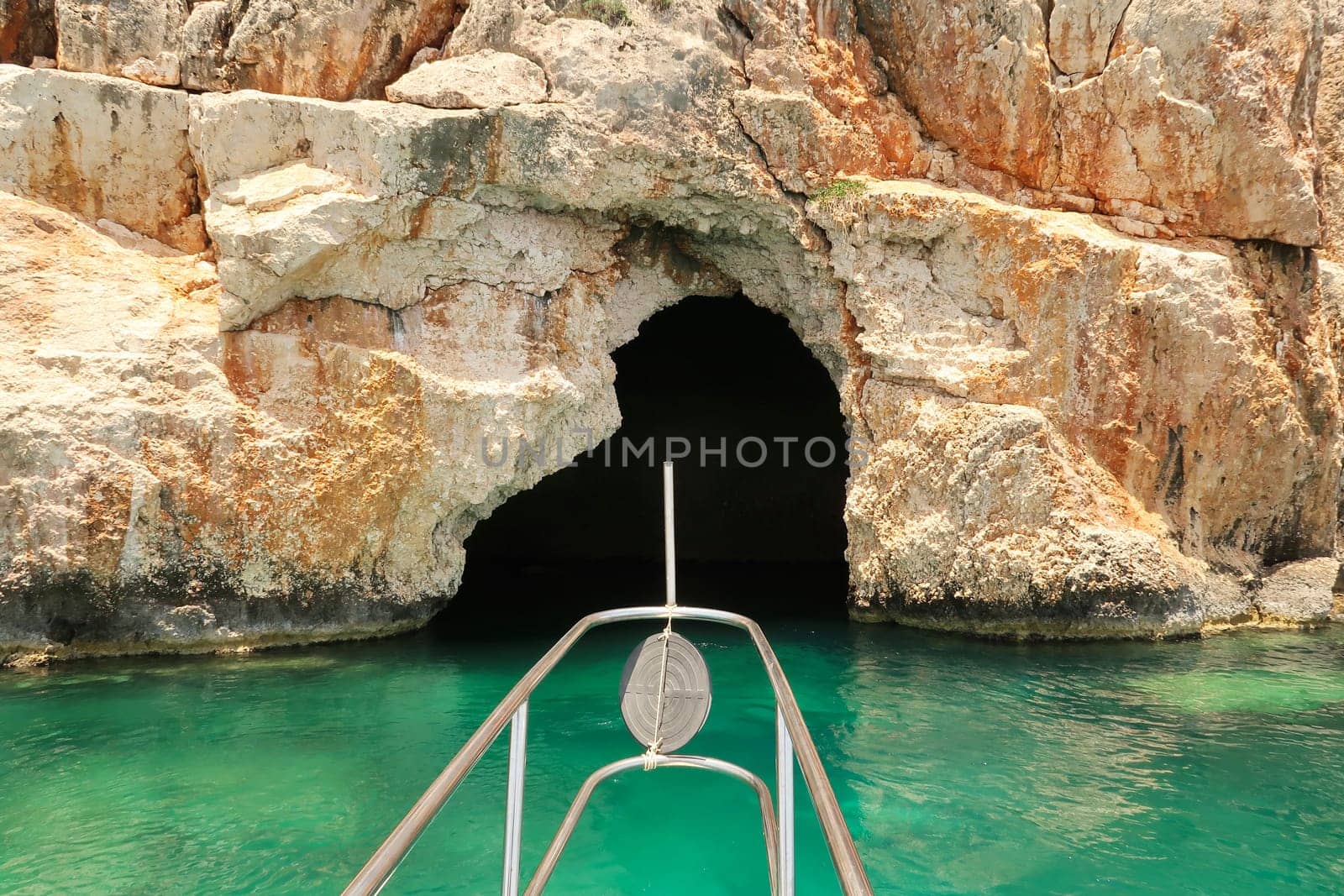 Approaching the famous Pirate Cave or Blue Cave on Asirli Island in the Gökkaya Bay on our Kekova Island boat trip, close to Demre, Turkey 2022
