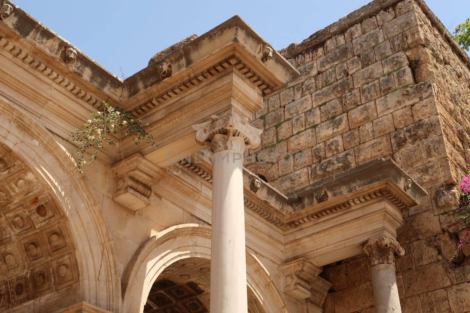Details on the upper part of the Hadrians Gate, famous ancient roman monument in Antalya, Turkey 2022