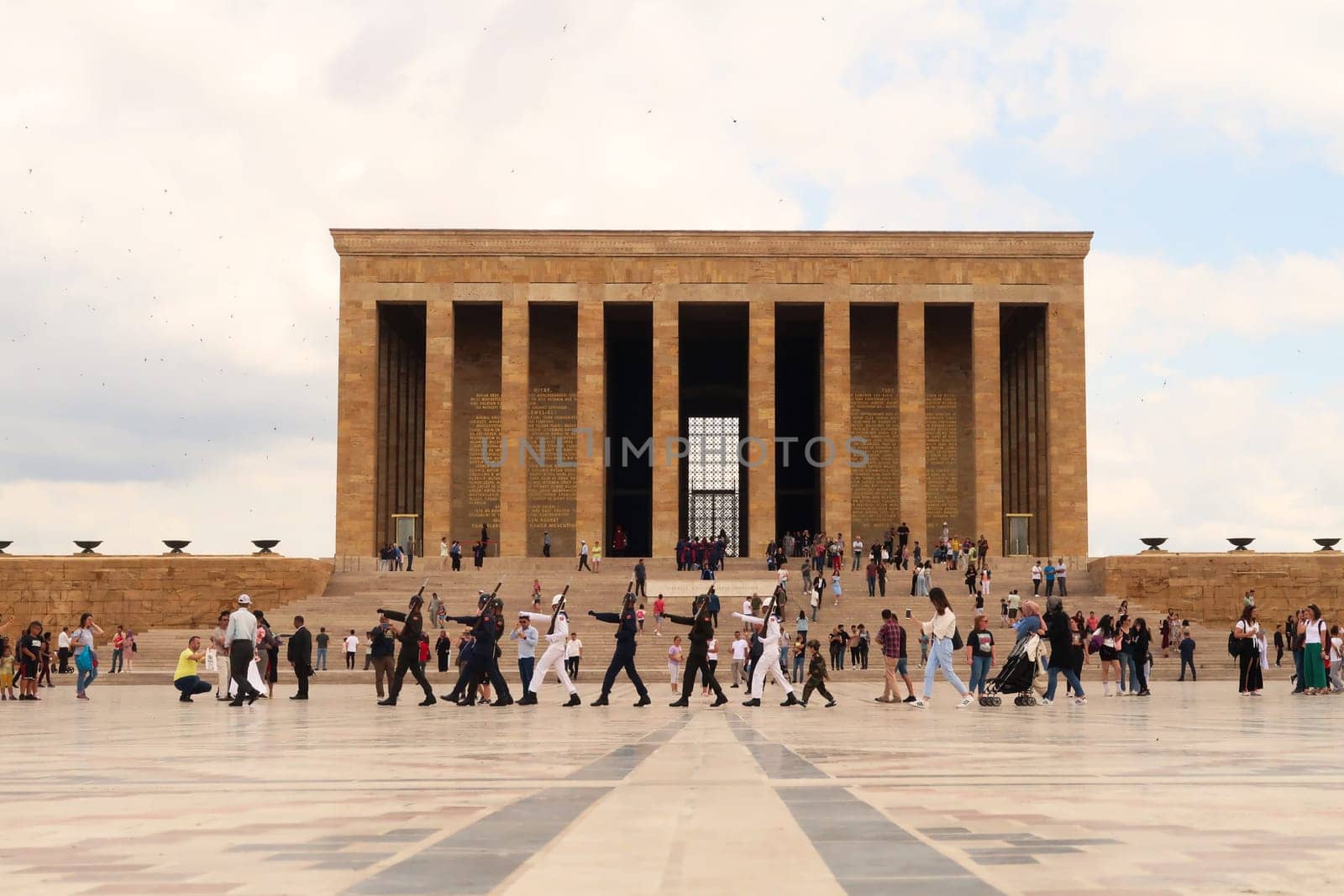 Turkish soldiers are marching on the Ceremonial Plaza of the Anitkabir complex, monument, memorial with the Hall of Honor in the background, housing the tomb, mausoleum of Atatürk, Ataturk, Ankara, Turkey, 1st of July 2022