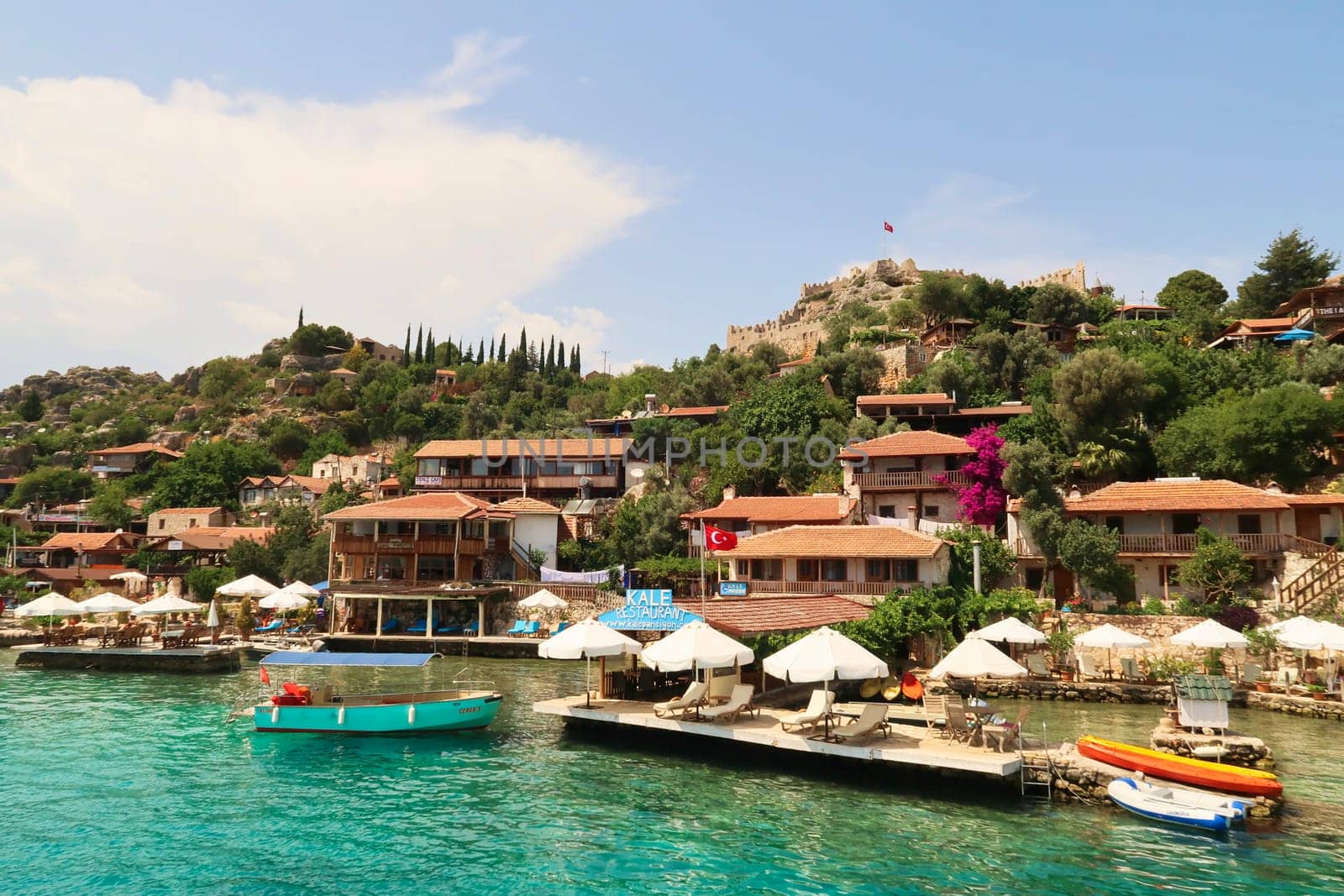 The beautiful coastal town of Kaleköy, ancient town of Simena seen from the boat on our Kekova Island Tour, near Demre, Turkey, 27th of May 2022