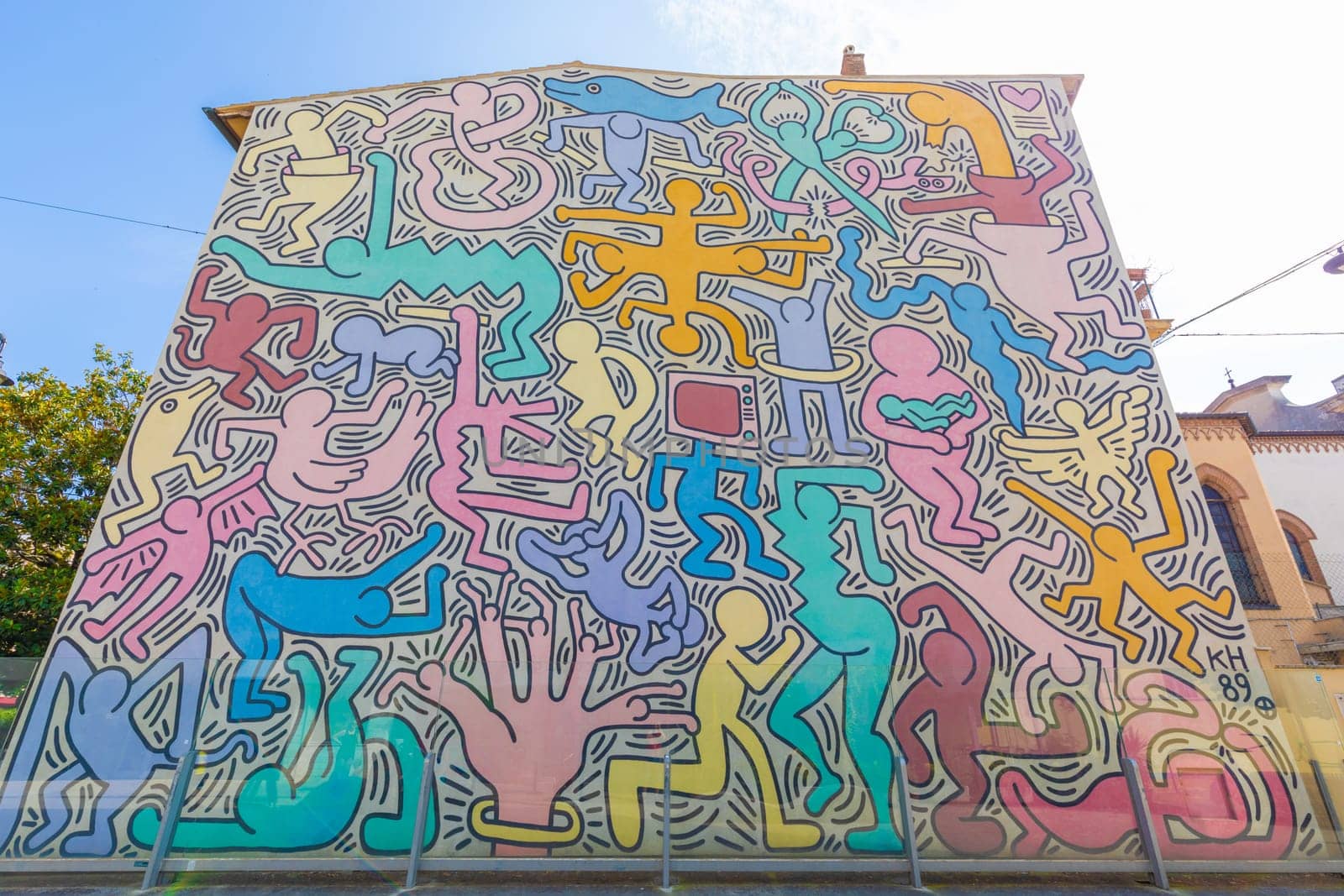 Pisa, Italy - 29 June 2023: Tuttomondo (All World) is the last mural created by American artist Keith Haring in 1989 before his death.